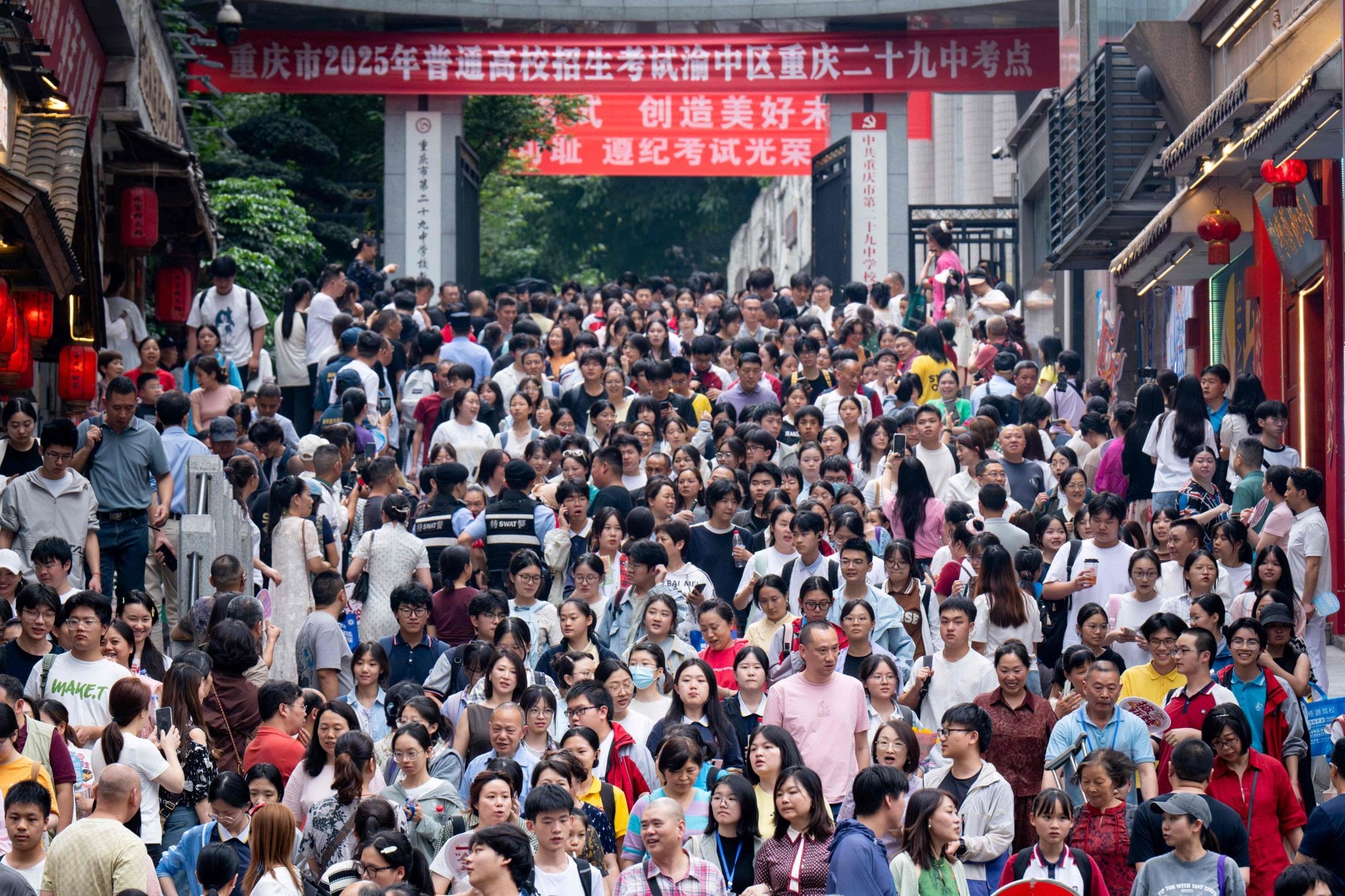 Students walk out to meet their parents after sitting China’s National College Entrance Examination, known as the gaokao, last year. Photo: AFP
