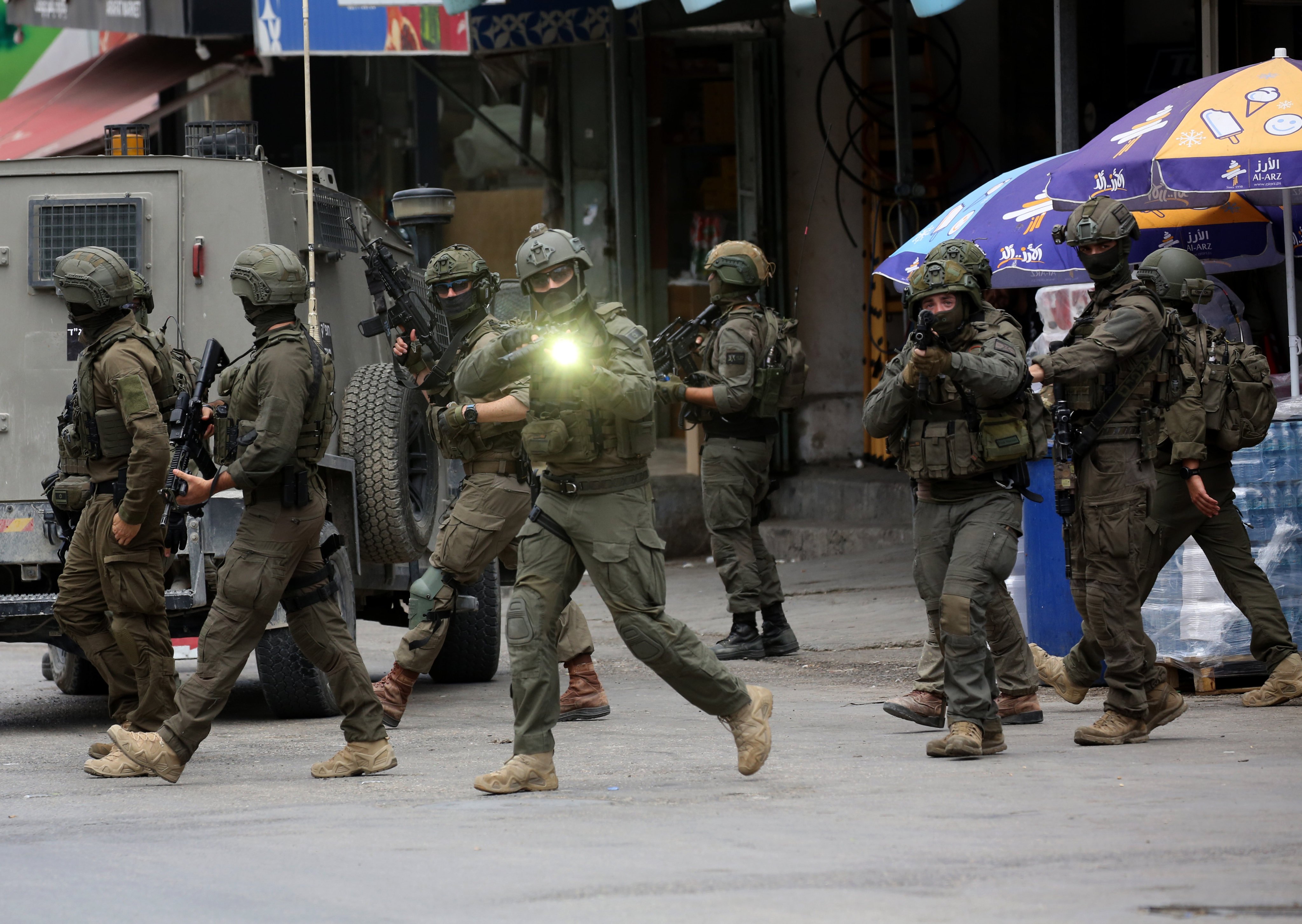 Israeli soldiers during clashes with Palestinian protesters following an Israeli military raid in the West Bank city of Nablus. Photo: Xinhua