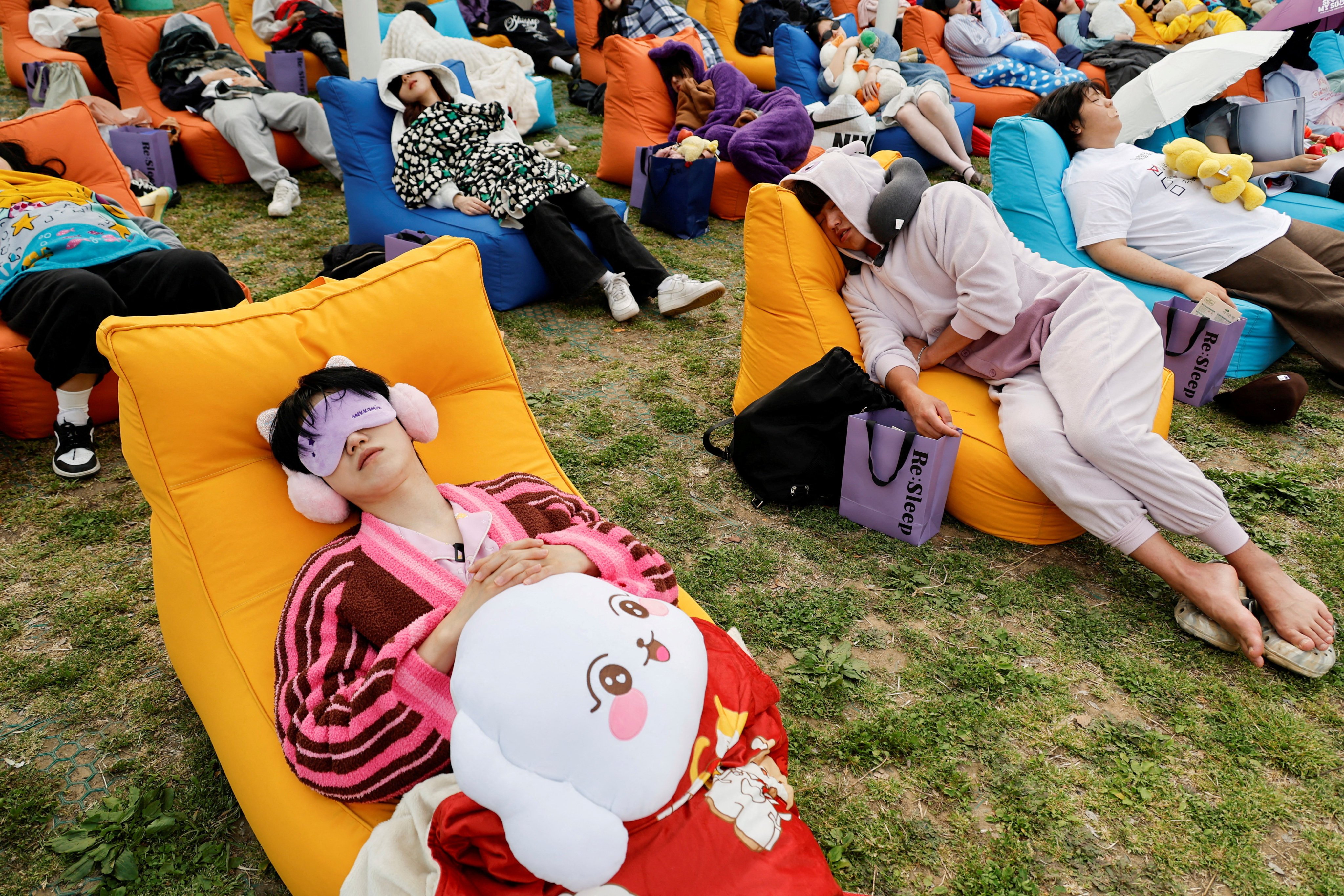Participants sleep during the 2026 Power Nap contest at Han River park in Seoul, South Korea, May 2, 2026. REUTERS/Kim Soo-hyeon     TPX IMAGES OF THE DAY