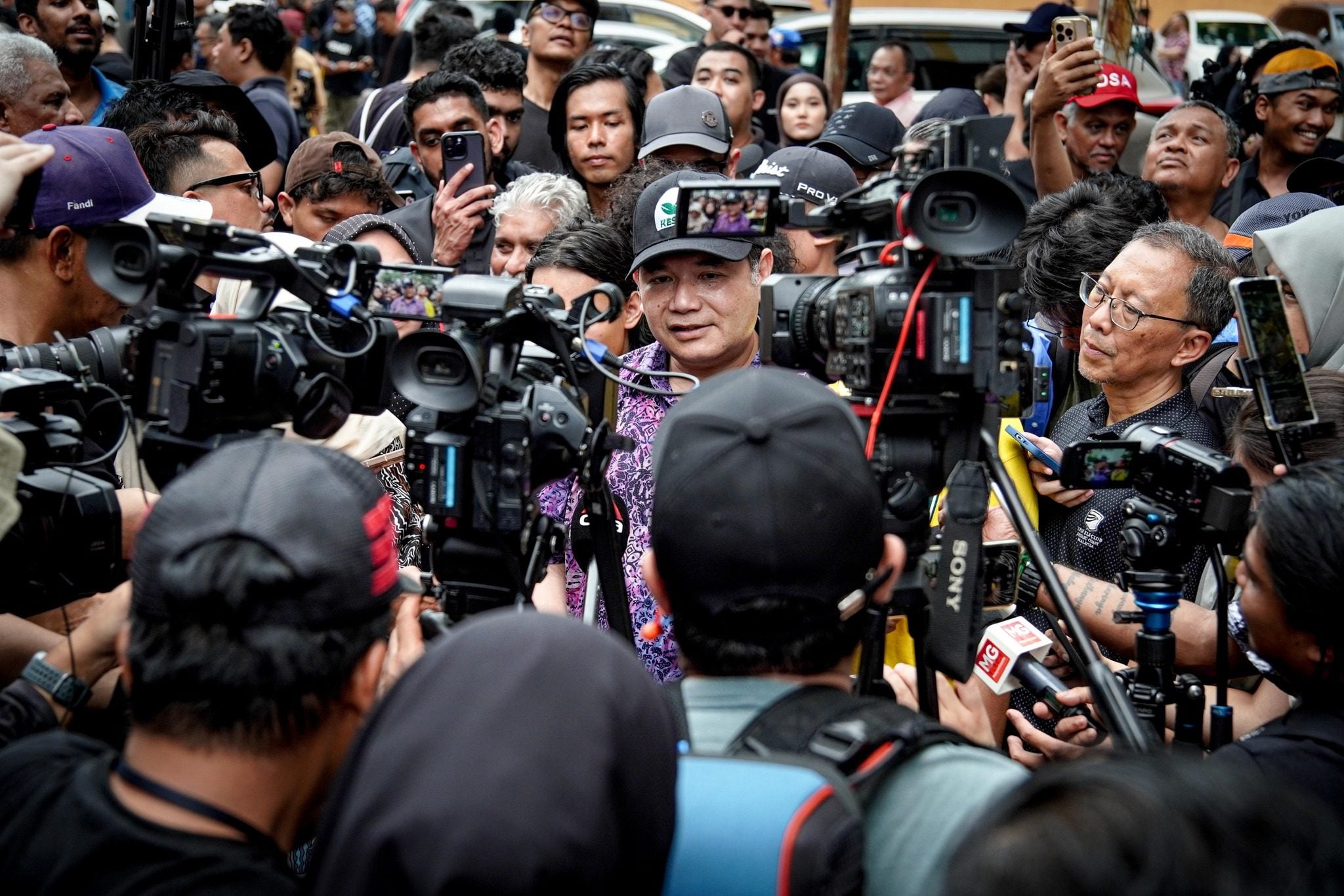 Rafizi Ramli (centre) speaks to reporters during a protest on April 25. Photo: Facebook/Rafizi Ramli