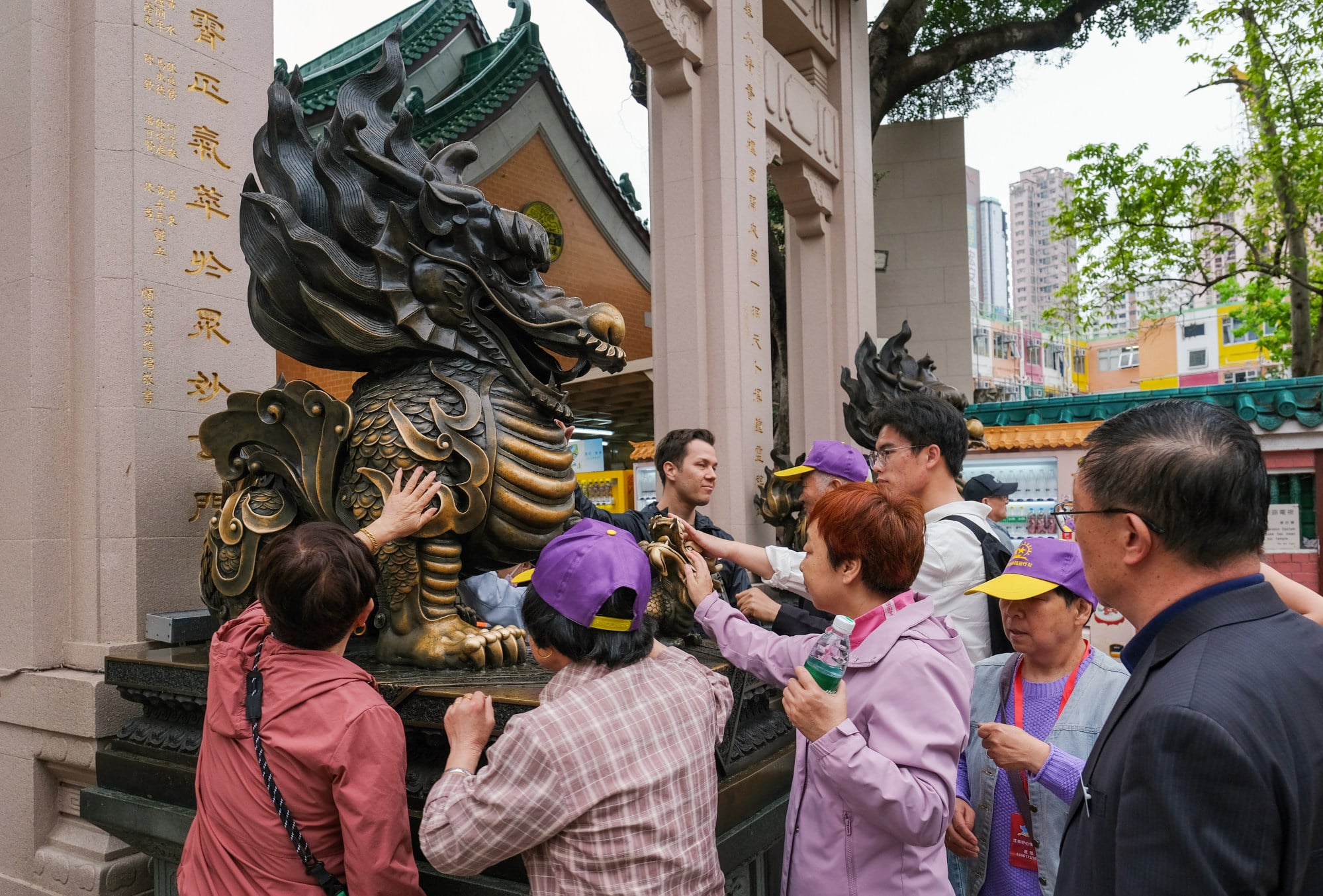 Tour group members visit Wong Tai Sin Temple. The Travel Industry Ordinance, which came fully into force in 2022, brought travel agents, tour guides and travel escorts under a unified licensing regime. Photo: Edmond So