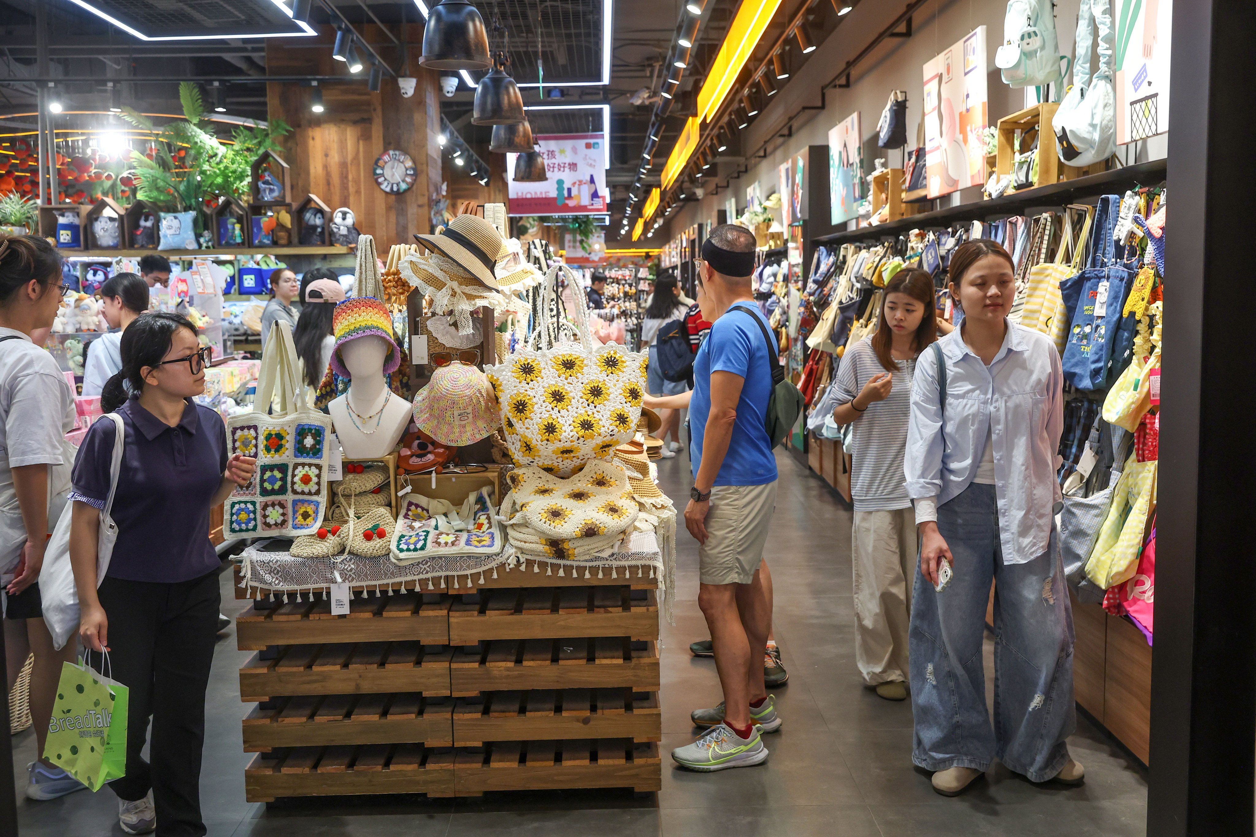 People shop at CoCo Park in Shenzhen last month. Photo: Edmond So