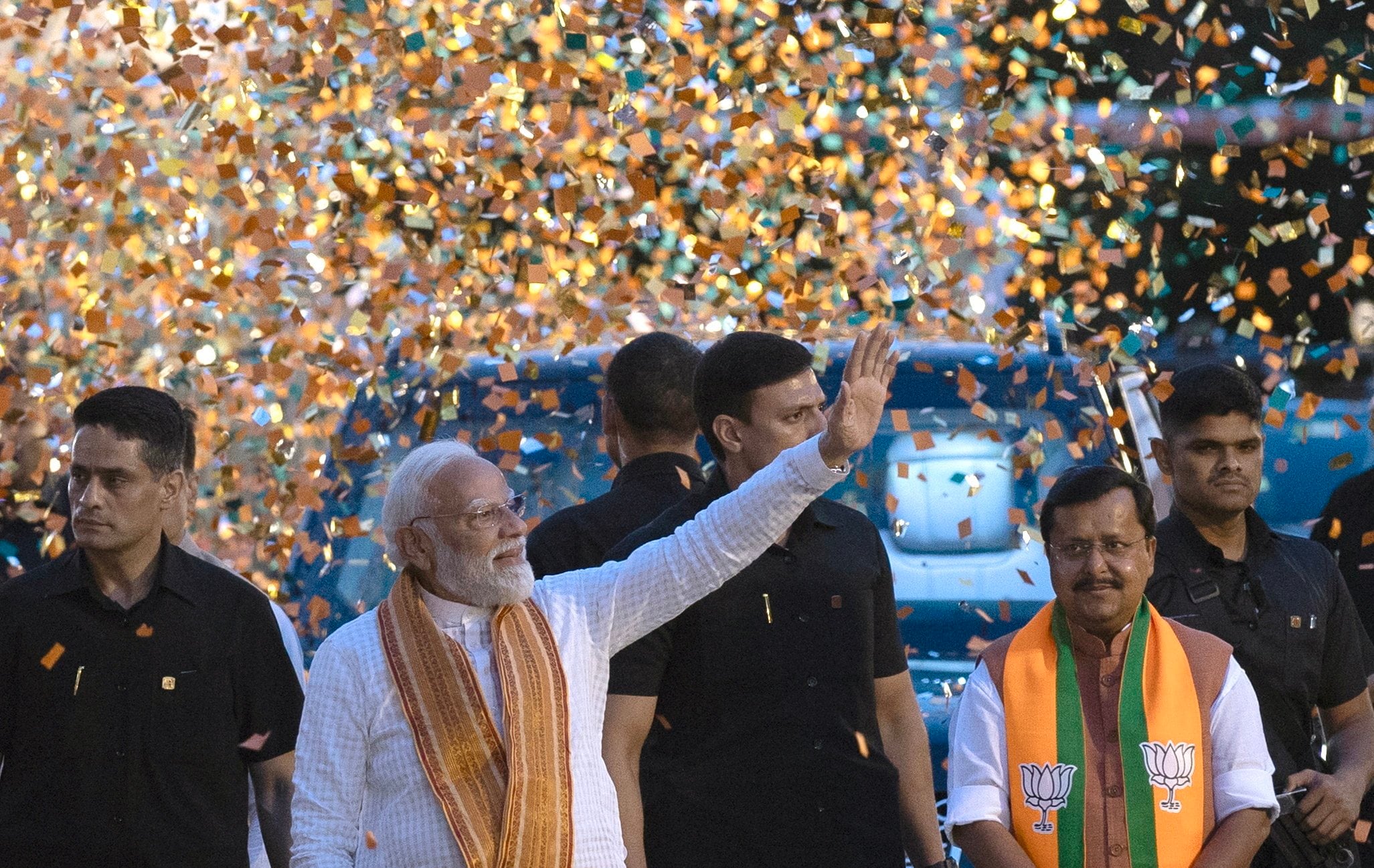 Bharatiya Janata Party leader and Indian Prime Minister Narendra Modi (waving) arrive at the party headquarters to deliver a victory speech, in New Delhi on Monday. Photo: EPA
