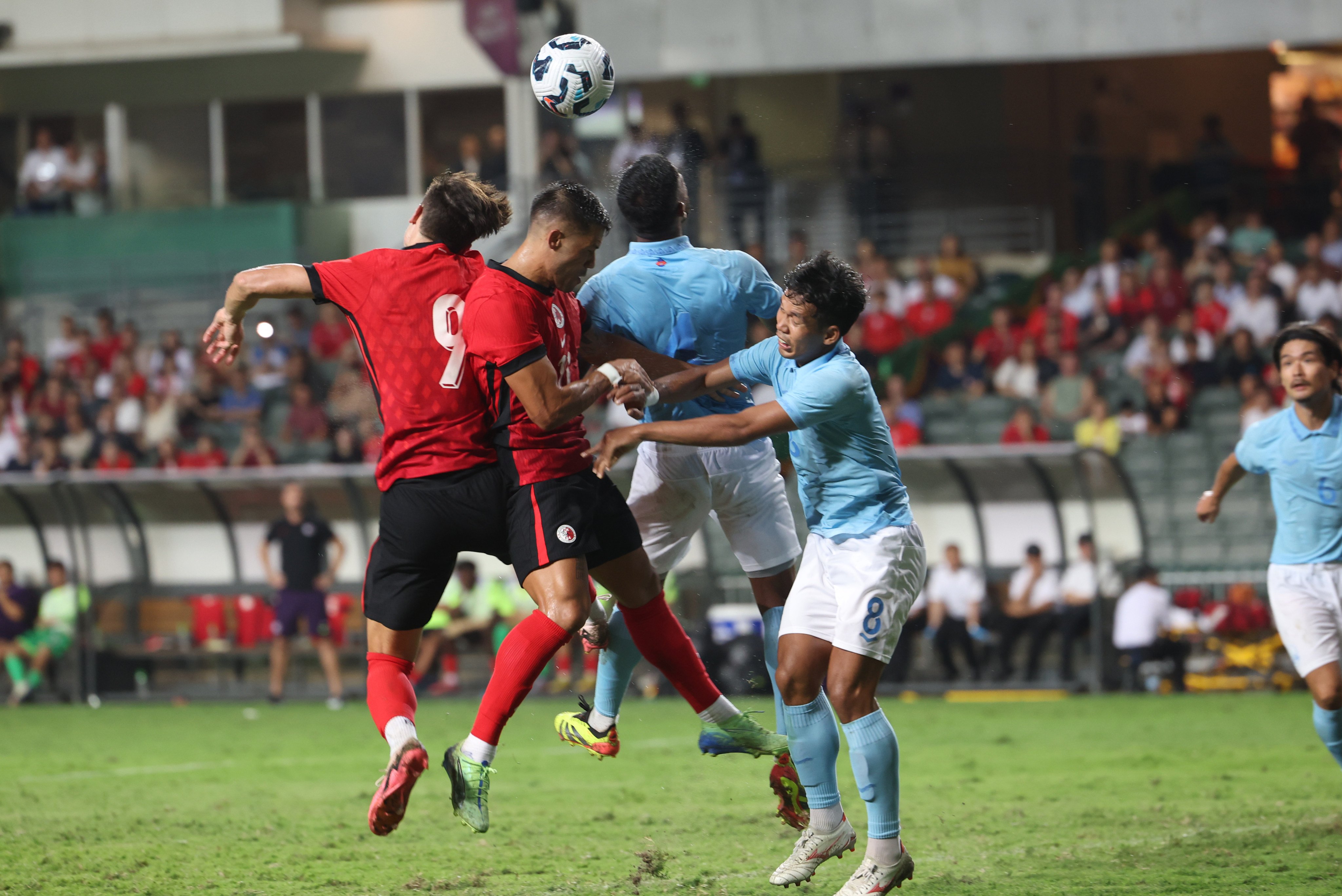 Hong Kong clashing with Cambodia during a Hong Kong Stadium friendly in October 2024. Photo: Dickson Lee
