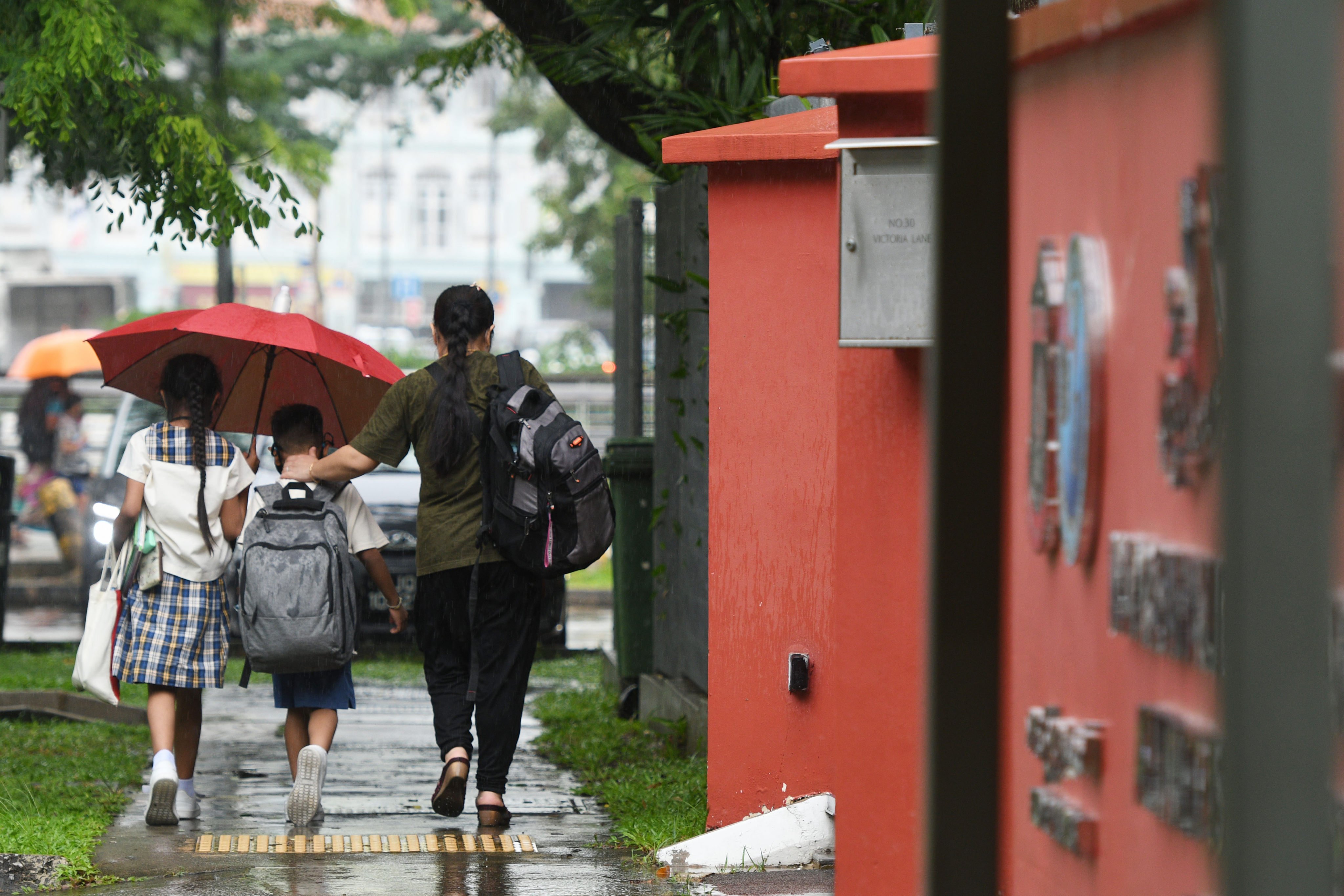Students leave school after class in Singapore. Photo: Xinhua