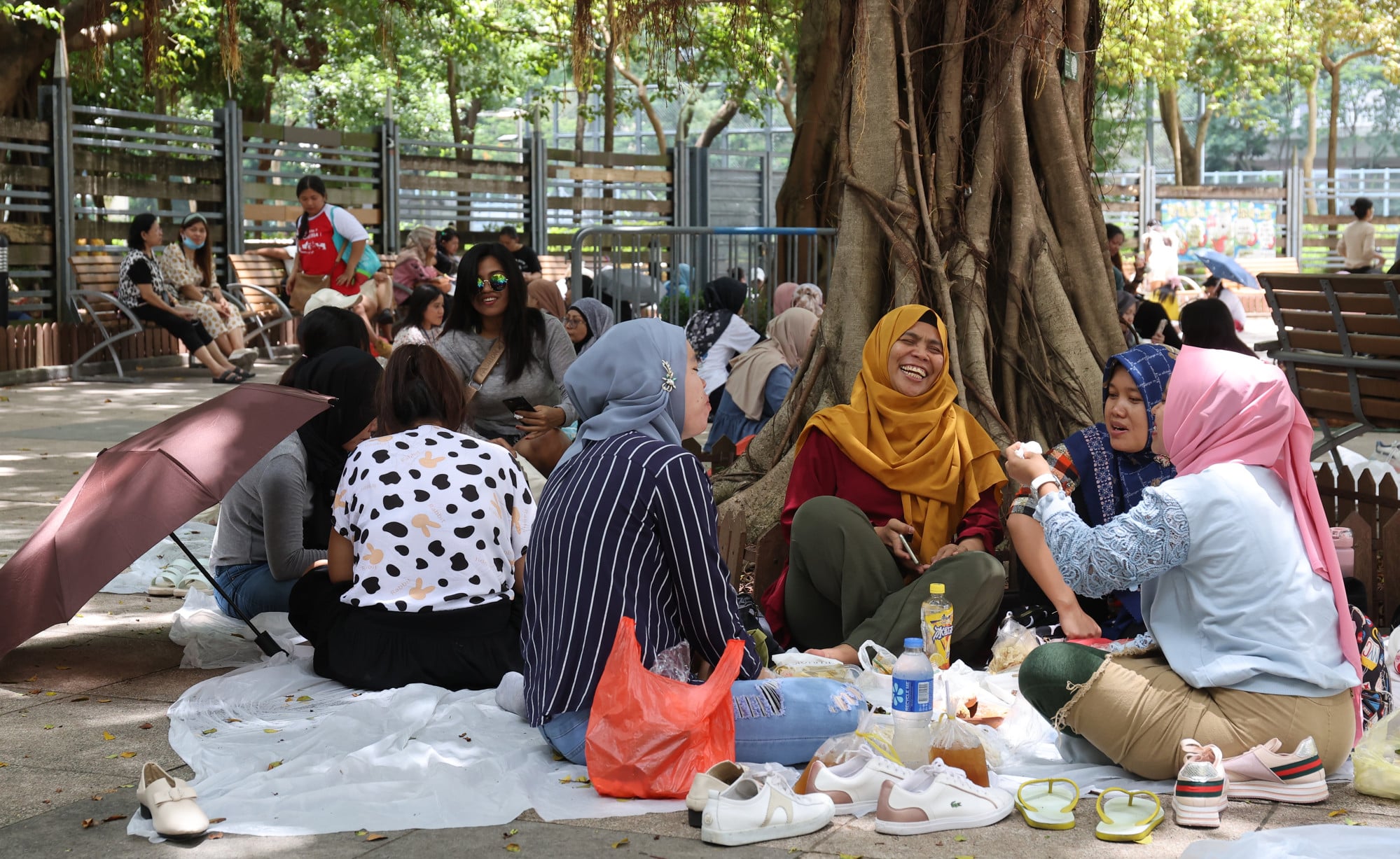Indonesian maids in Victoria Park. Joselyn Bisquera, a beneficiary of Enrich’s courses, says she realised the importance of financial literacy after she suddenly lost her job during the Covid pandemic and needed money. Photo: Edmond So