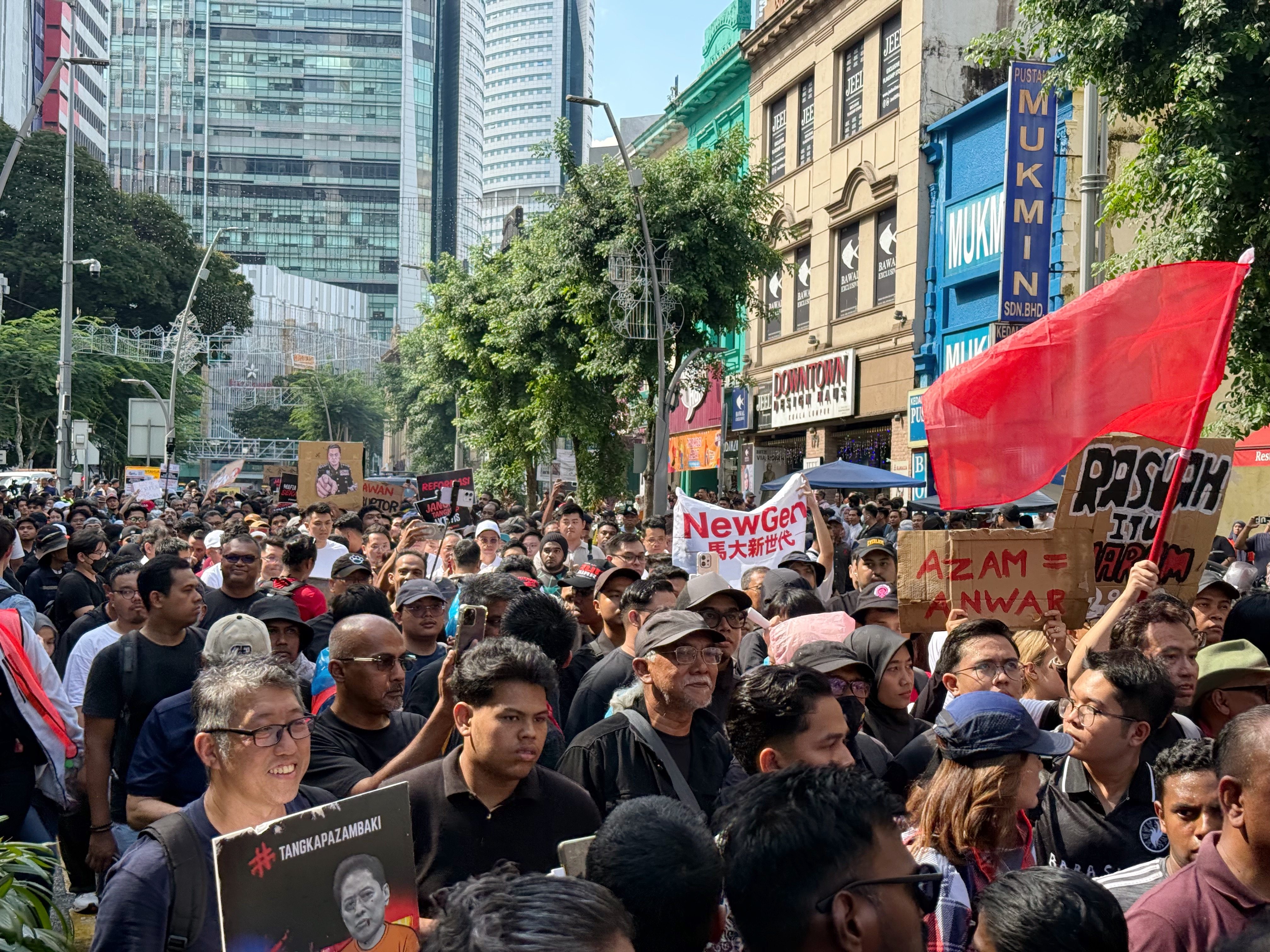 Around 200 protesters march through central Kuala Lumpur protest against MACC chief  Azam Baki on April 25. Photo: Iman Muttaqin Yusof
