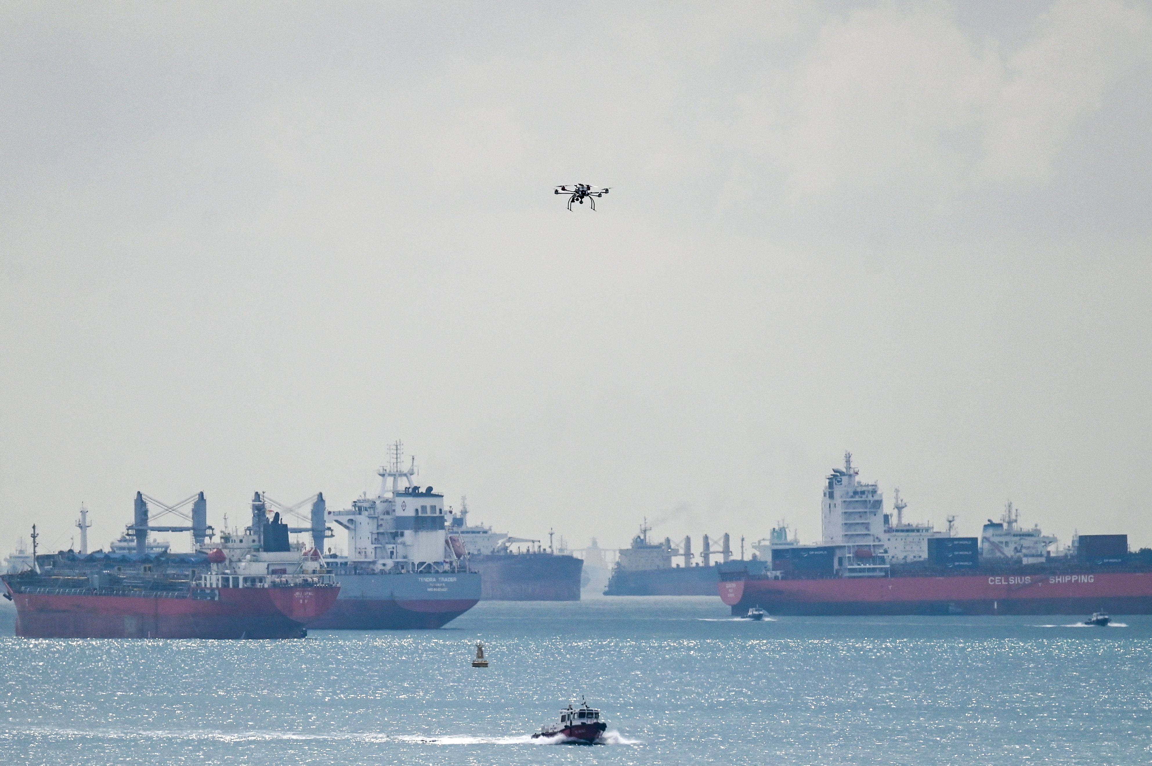 Vessels are seen at anchor in the Singapore Strait as a drone flies on April 21. Photo: AFP