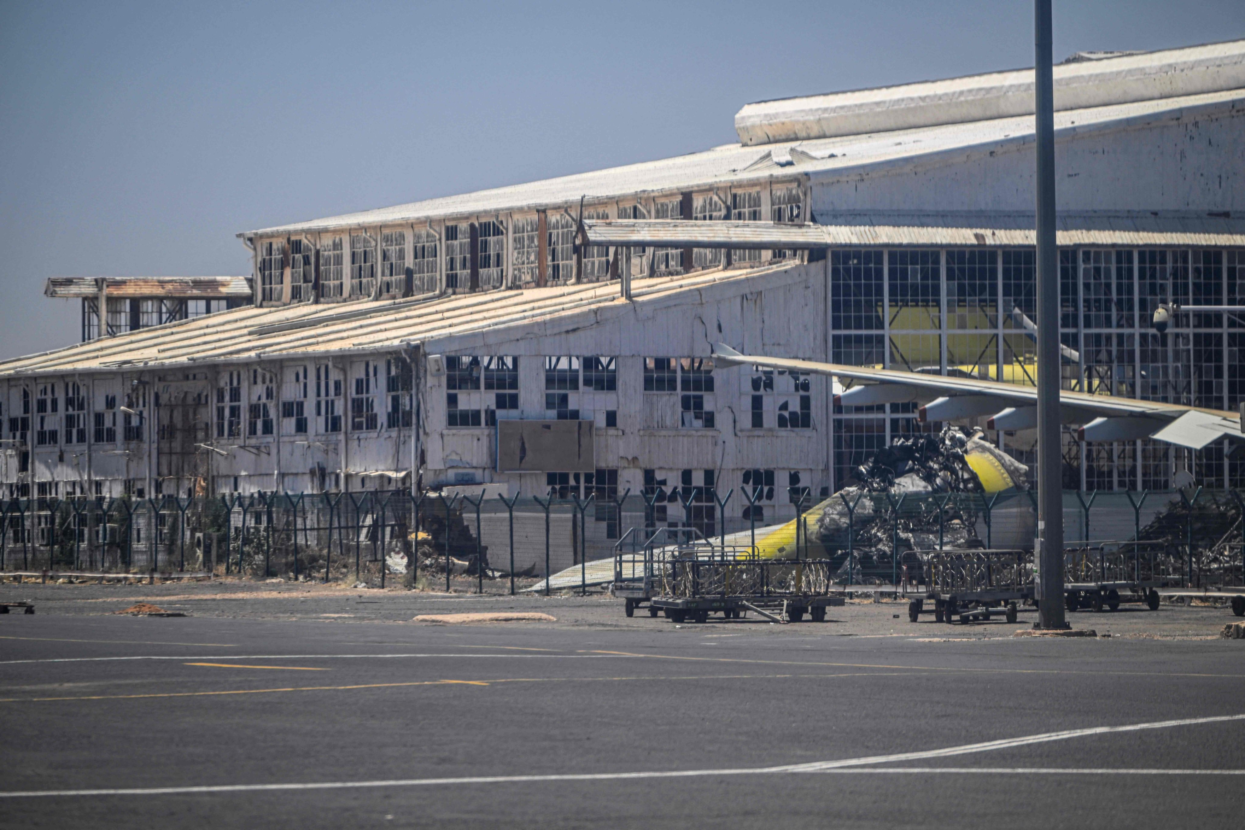 Aircraft wreckage and previously damaged structures at Khartoum International Airport - where some of the earliest fighting erupted in 2023. Photo: AFP