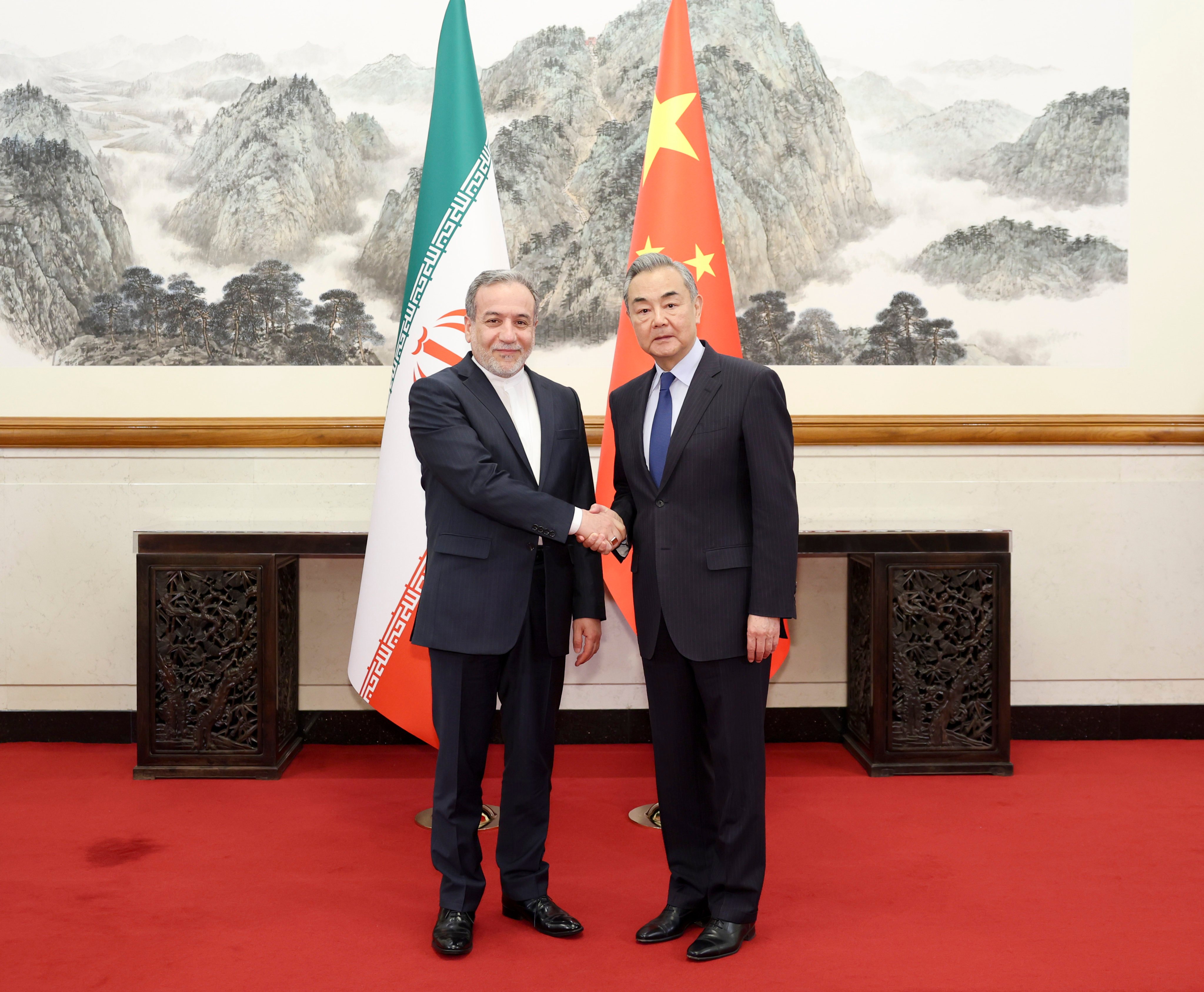 Chinese Foreign Minister Wang Yi (right) with Iranian counterpart Abbas Araghchi in Beijing in April 2025. Photo: Xinhua