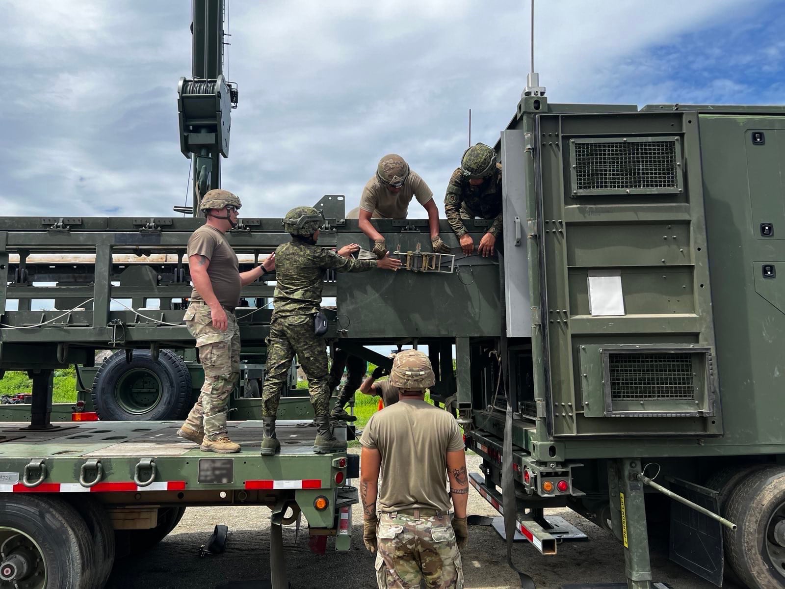 US and Philippine army soldiers fasten the Mid-Range Capability reload fixture to the Typhon system as part of Exercise Salaknib on June 27, 2024. Photo: US Army