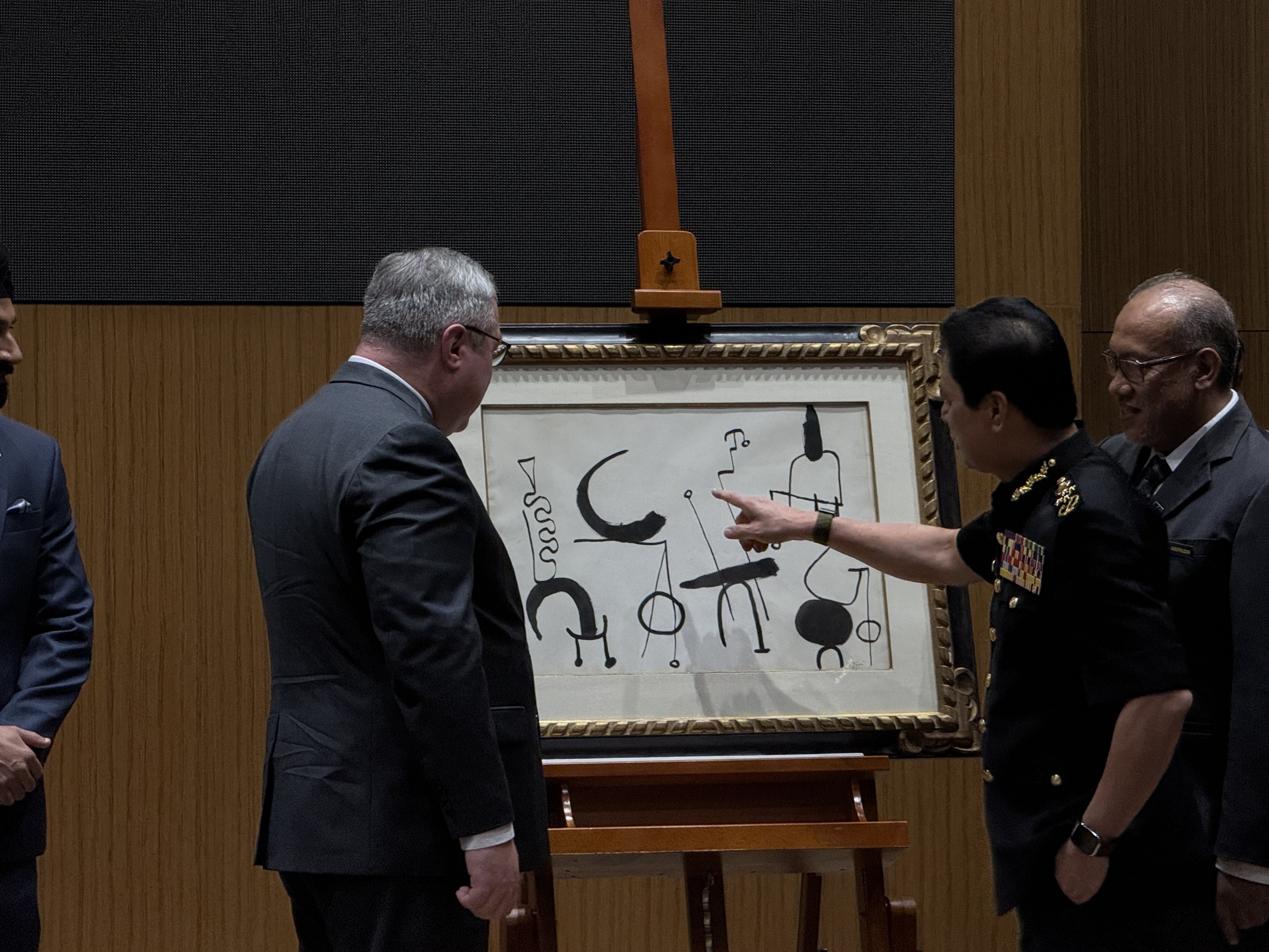 Malaysian Anti-Corruption Commission chief Azam Baki (second from right) inspects Joan Miro’s “Composition” (1953) at the MACC headquarters in Putrajaya on Wednesday. Photo: Iman Muttaqin Yusof