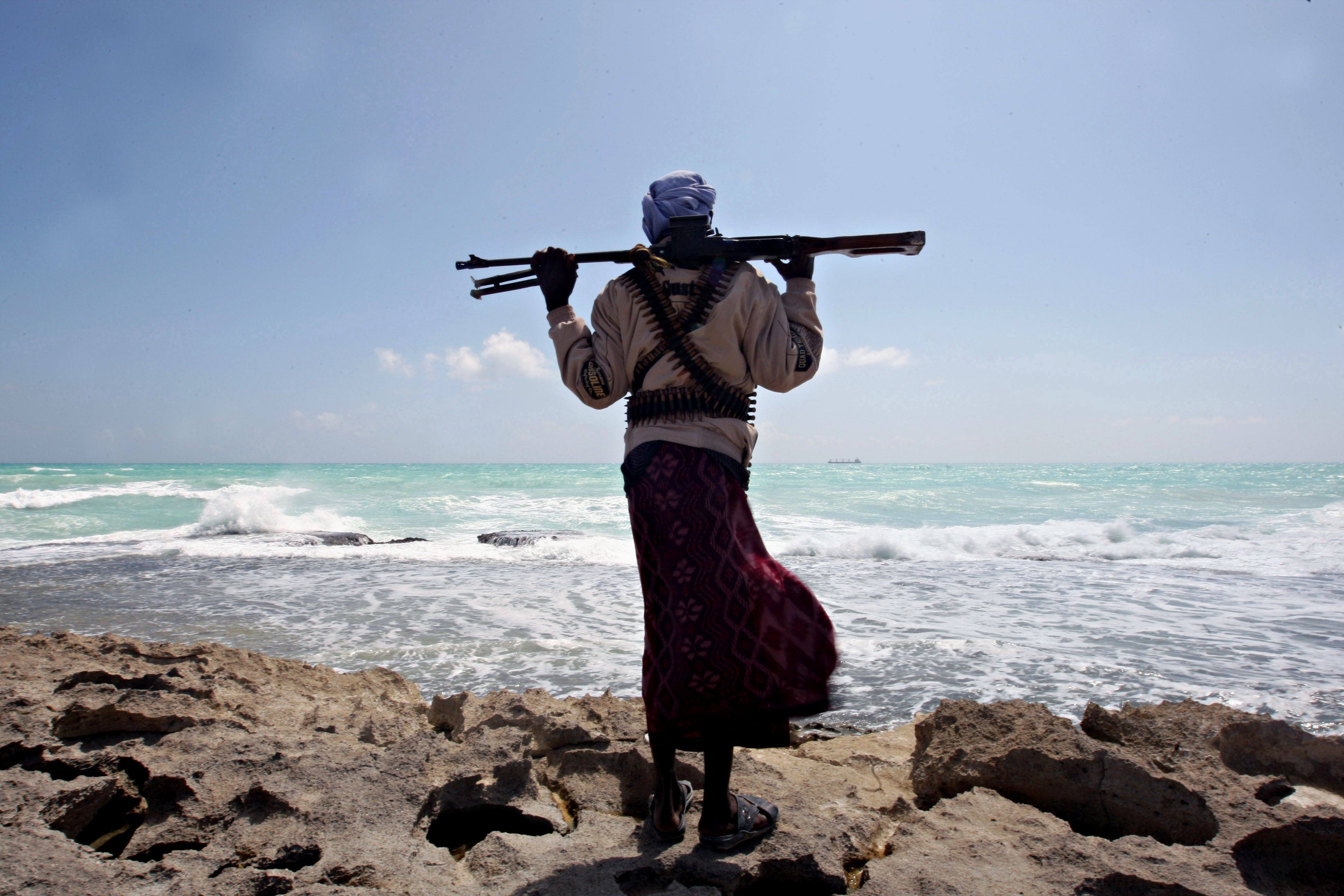 An armed Somali pirate along the coastline in northeastern Somalia. Photo: AFP
