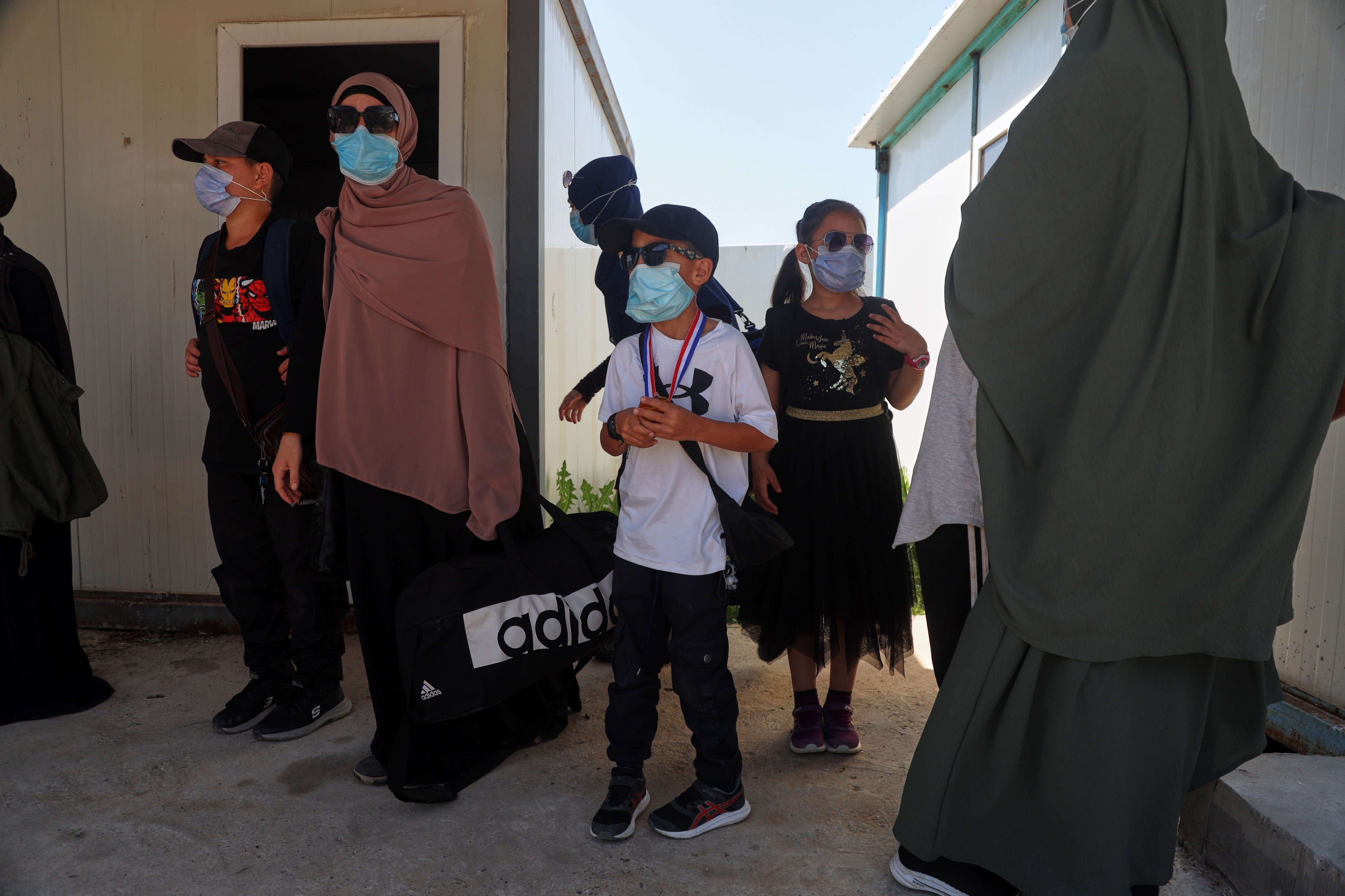 Members of Australian families at Roj camp prepare to leave for Damascus as part of a second repatriation effort by Syrian authorities on April 24. Photo: AP