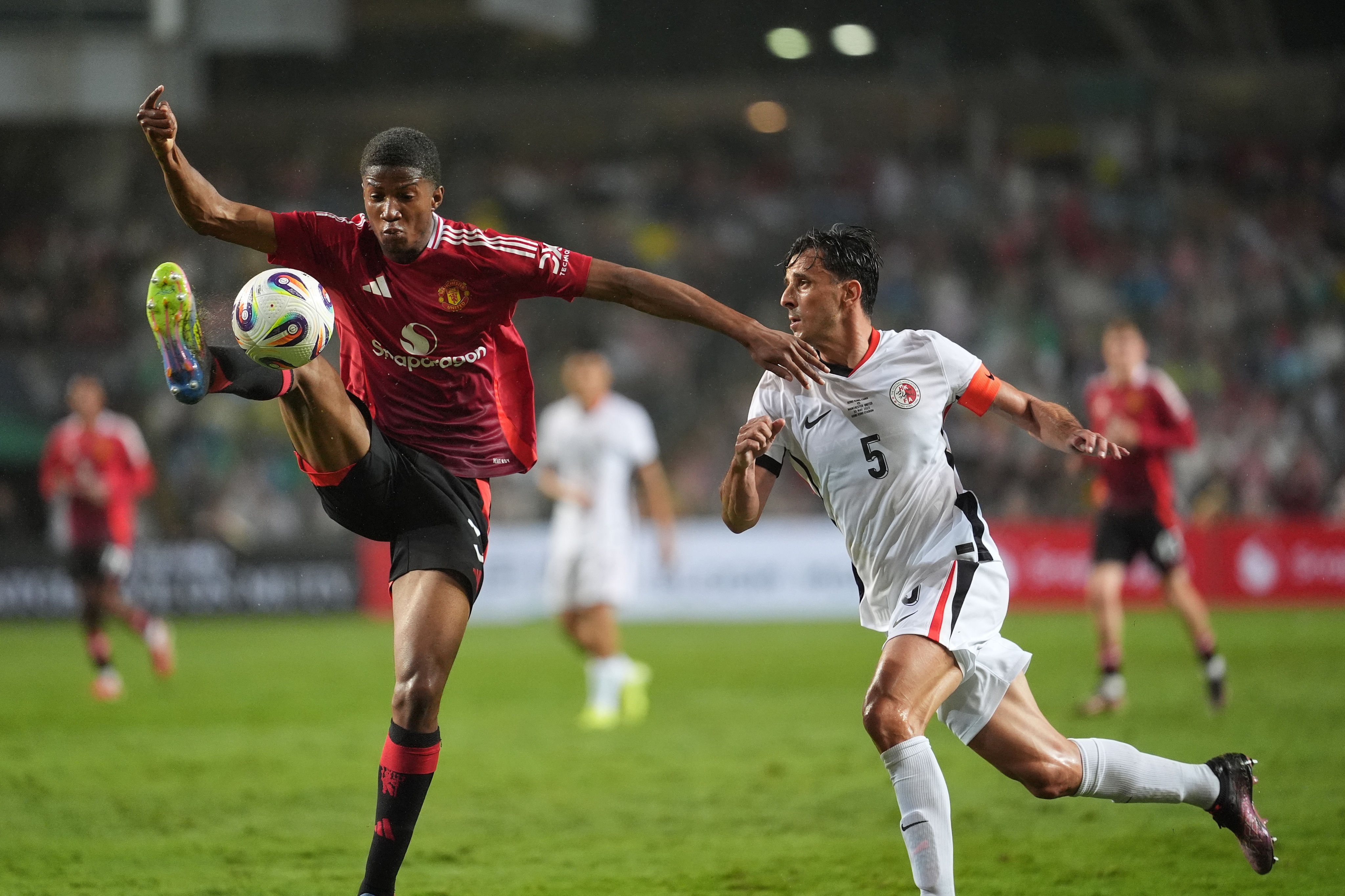 Helio Goncalves (right) in action for Hong Kong during the city team’s friendly with Manchester United last year. Photo: Elson Li