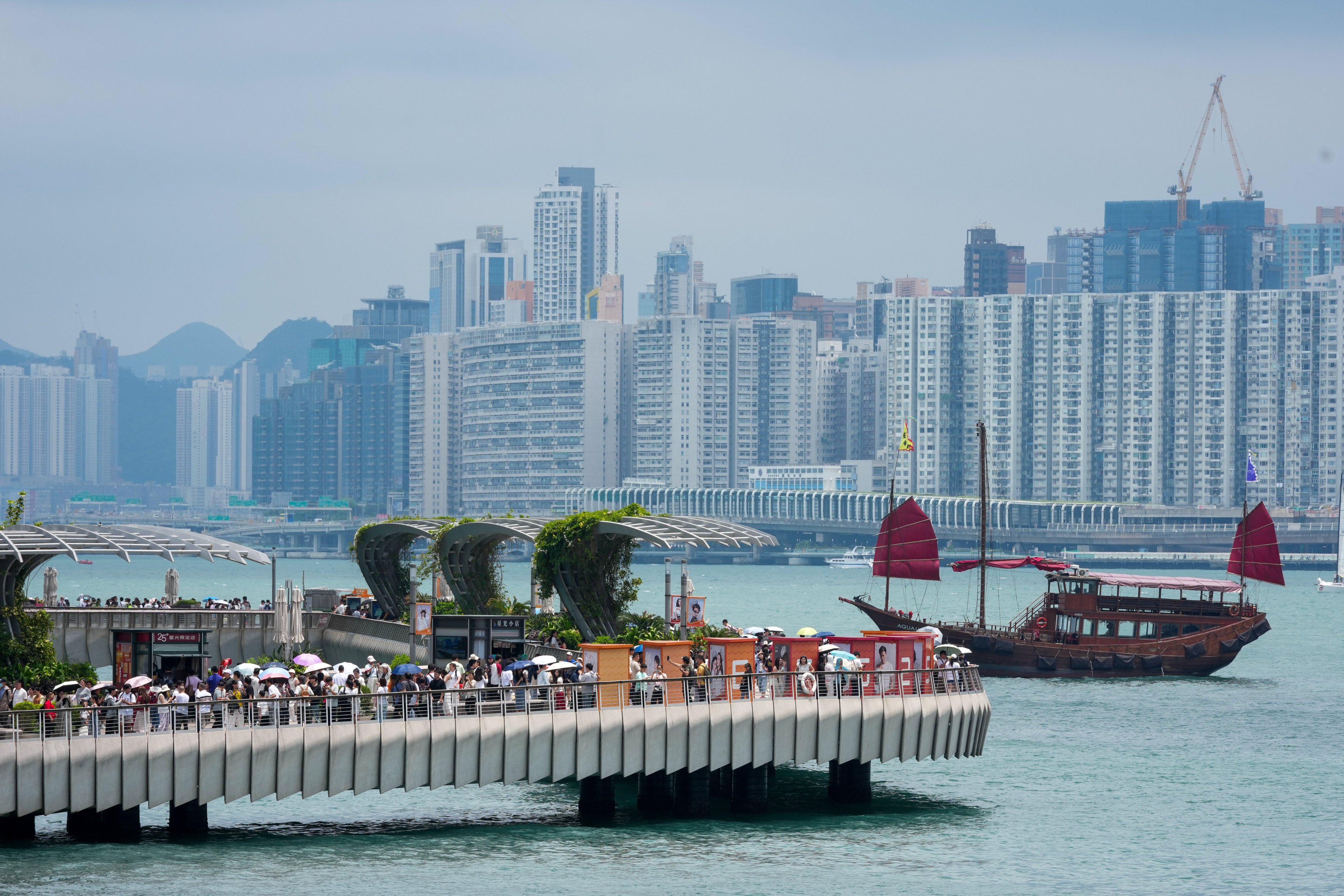 People enjoy the Tsim Sha Tsui waterfront on May 1, the first day of China’s “golden week” Labour Day holidays. Photo: Jelly Tse