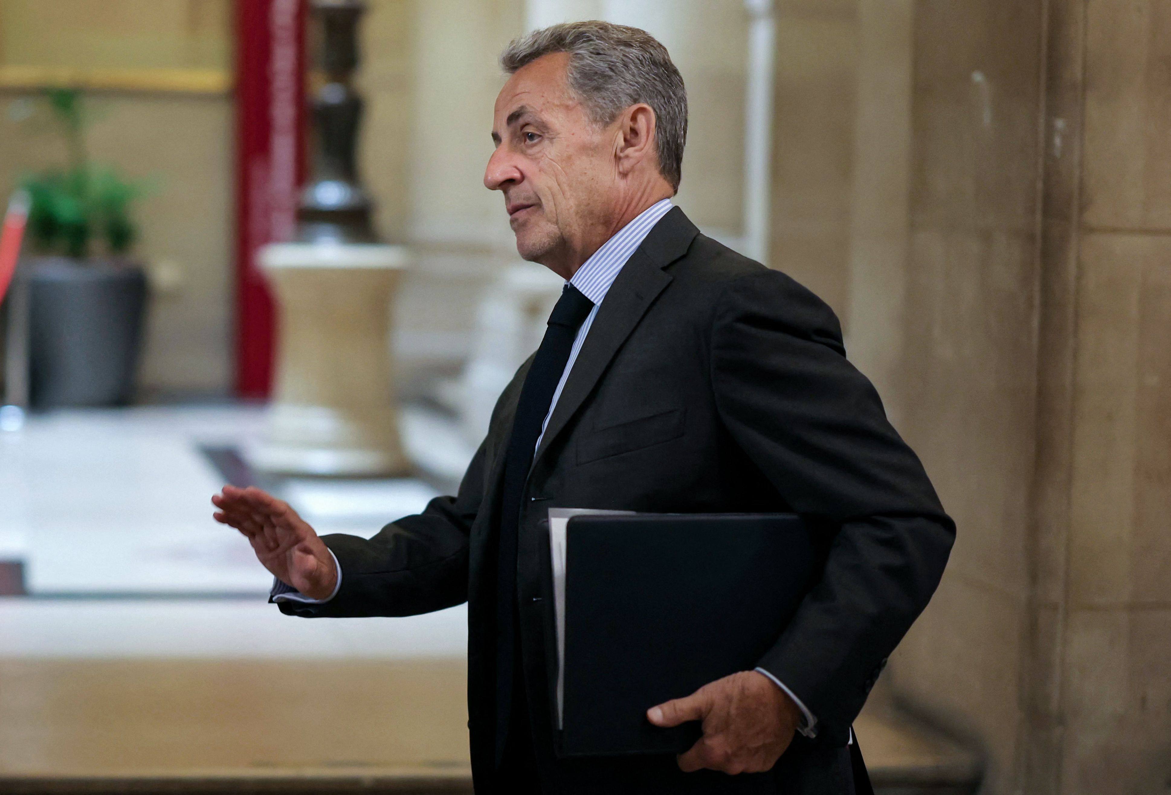 France’s former president Nicolas Sarkozy leaves the courtroom on Wednesday during a break at his appeal trial over charges he had sought Libyan financing for his 2007 election. Photo: AFP