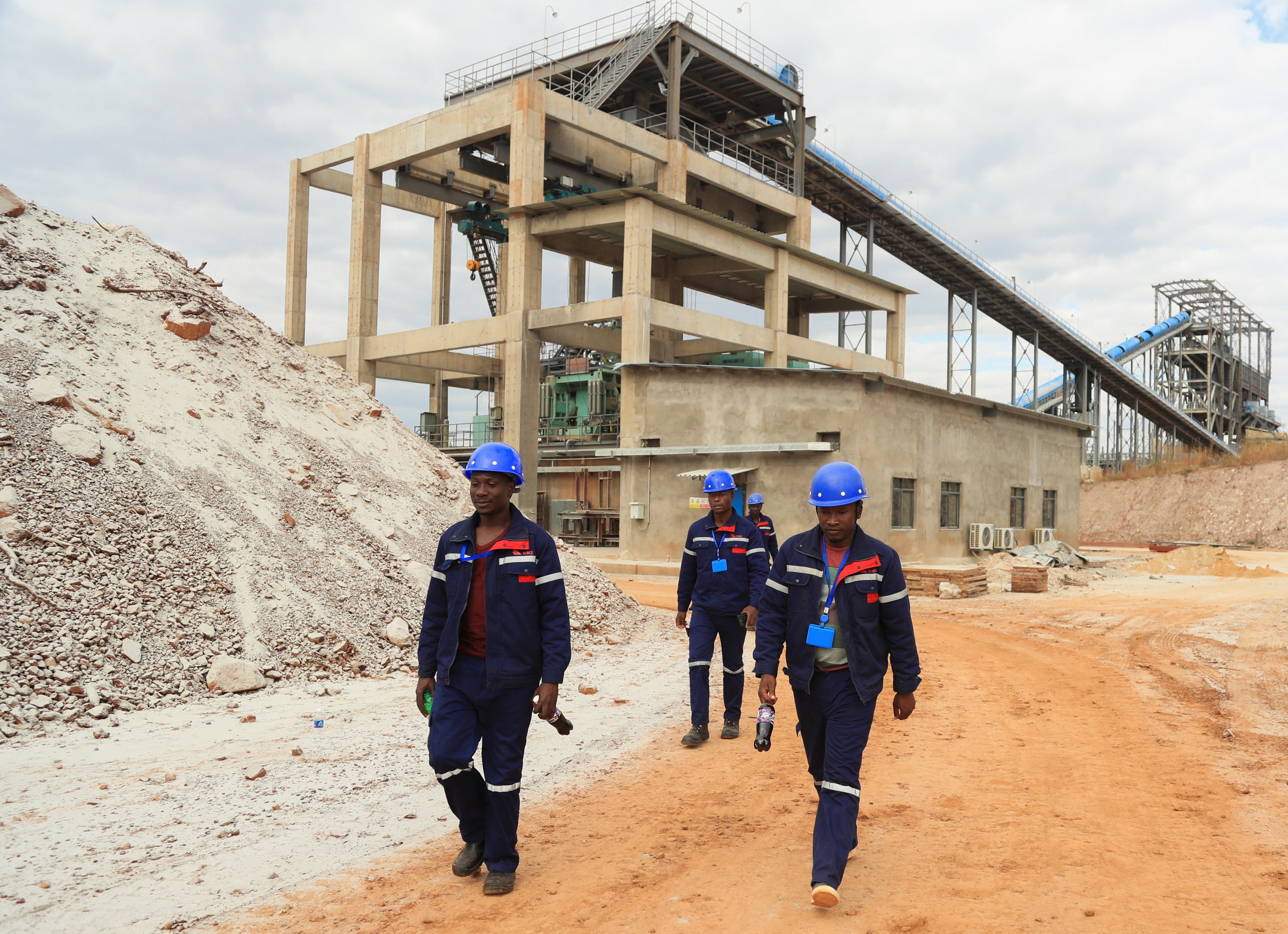 Workers are seen during a break at Prospect Lithium mine and processing plant in Goromonzi, Zimbabwe July 5, 2023. Photo: Reuters