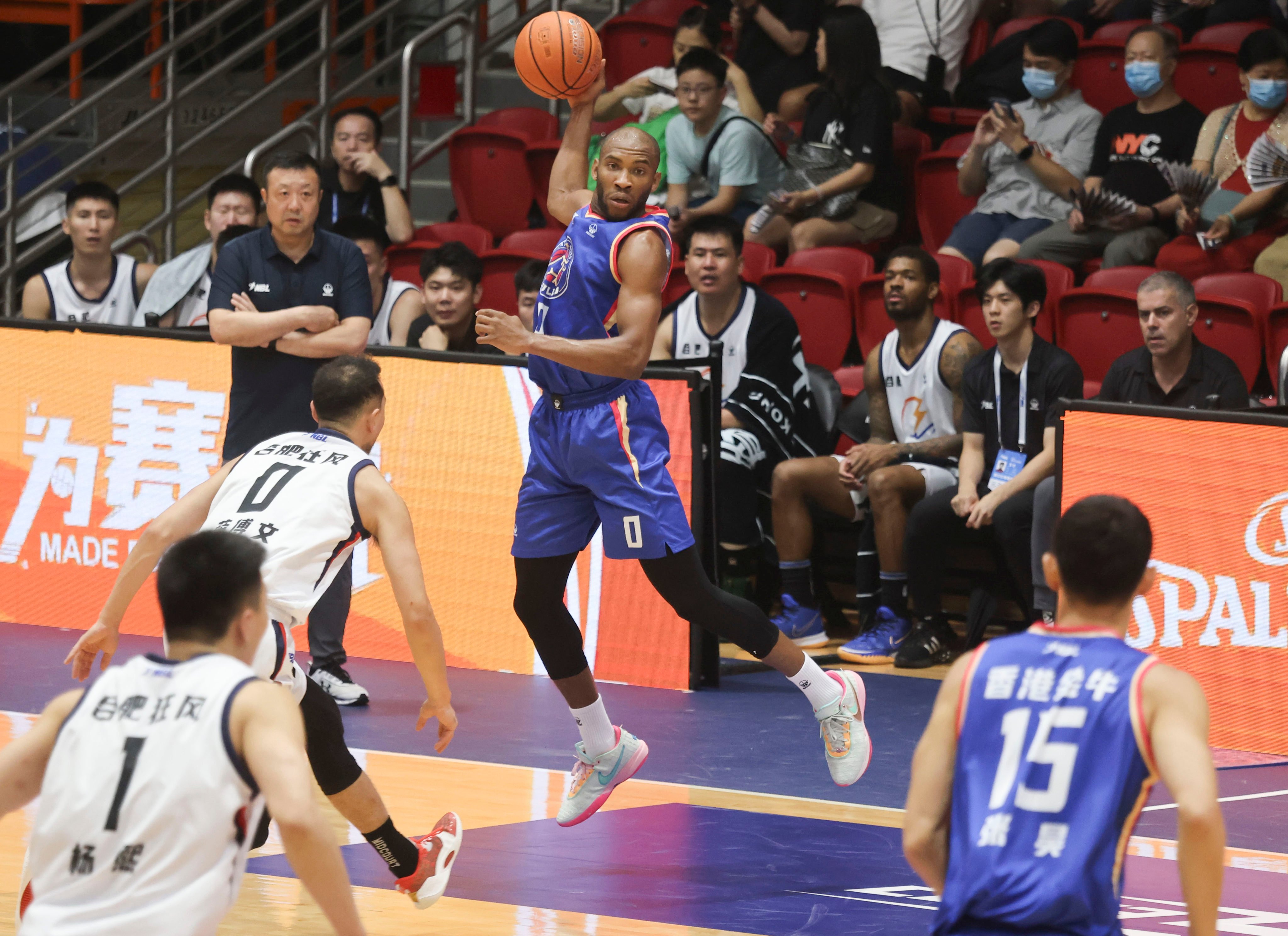 Hong Kong Bulls (blue) are waiting to learn their fate about playing in the top tier of the Chinese basketball league. Photo: Jonathan Wong