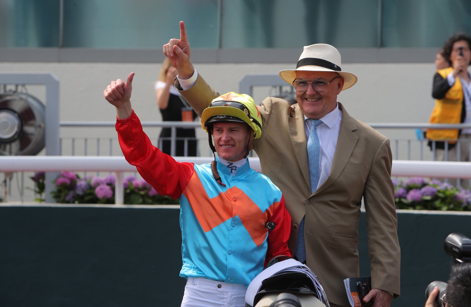 Jockey Zac Purton and trainer David Hayes celebrate Ka Ying Rising’s Chairman’s Sprint Prize win.