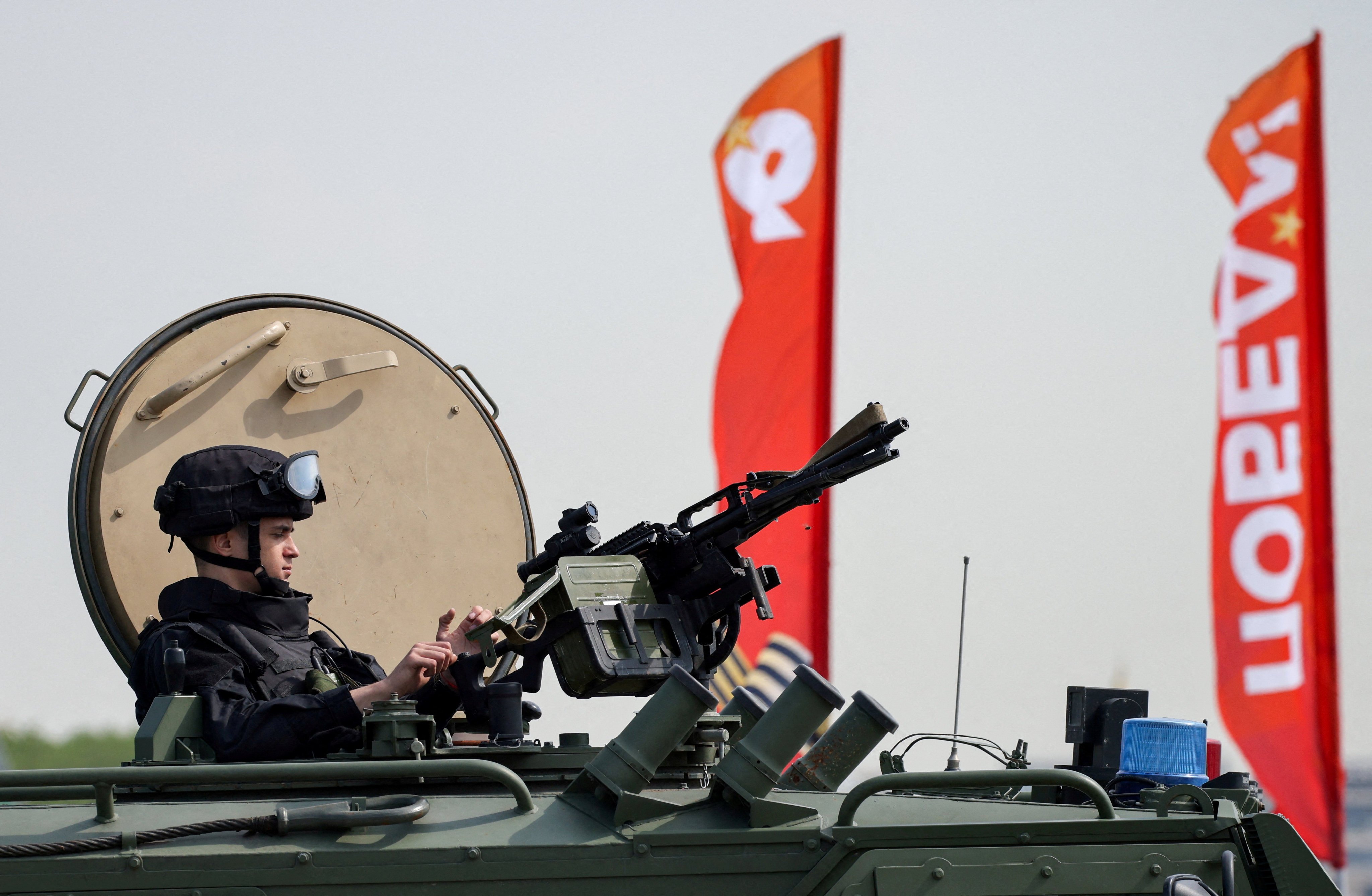 A Russian security officer atop an all-terrain infantry mobility vehicle in central Moscow. Photo: Reuters