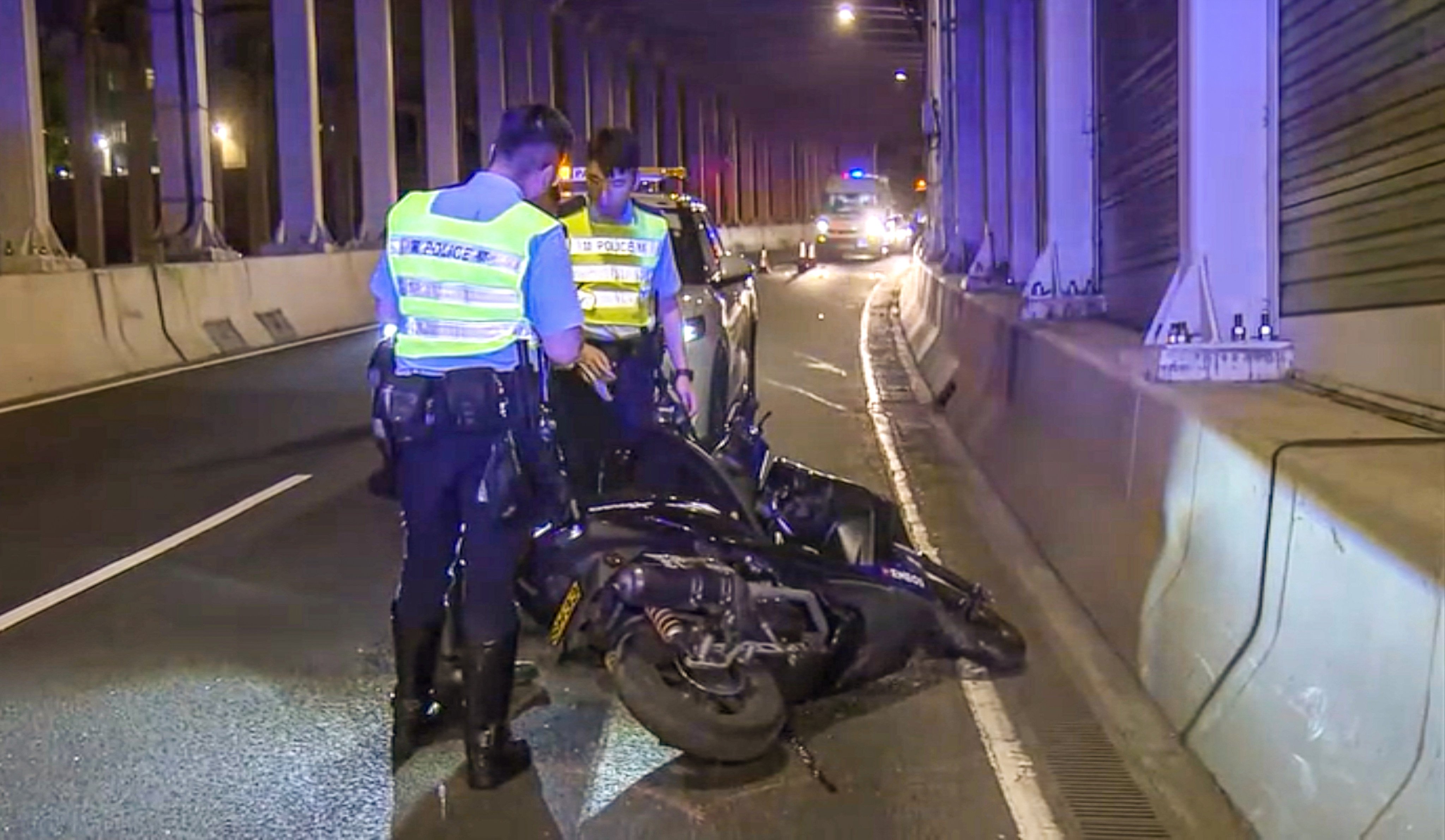 A motorcyclist has died after reportedly losing control of his vehicle and overturning inside the Eastern Harbour Crossing. Photo: Now TV News