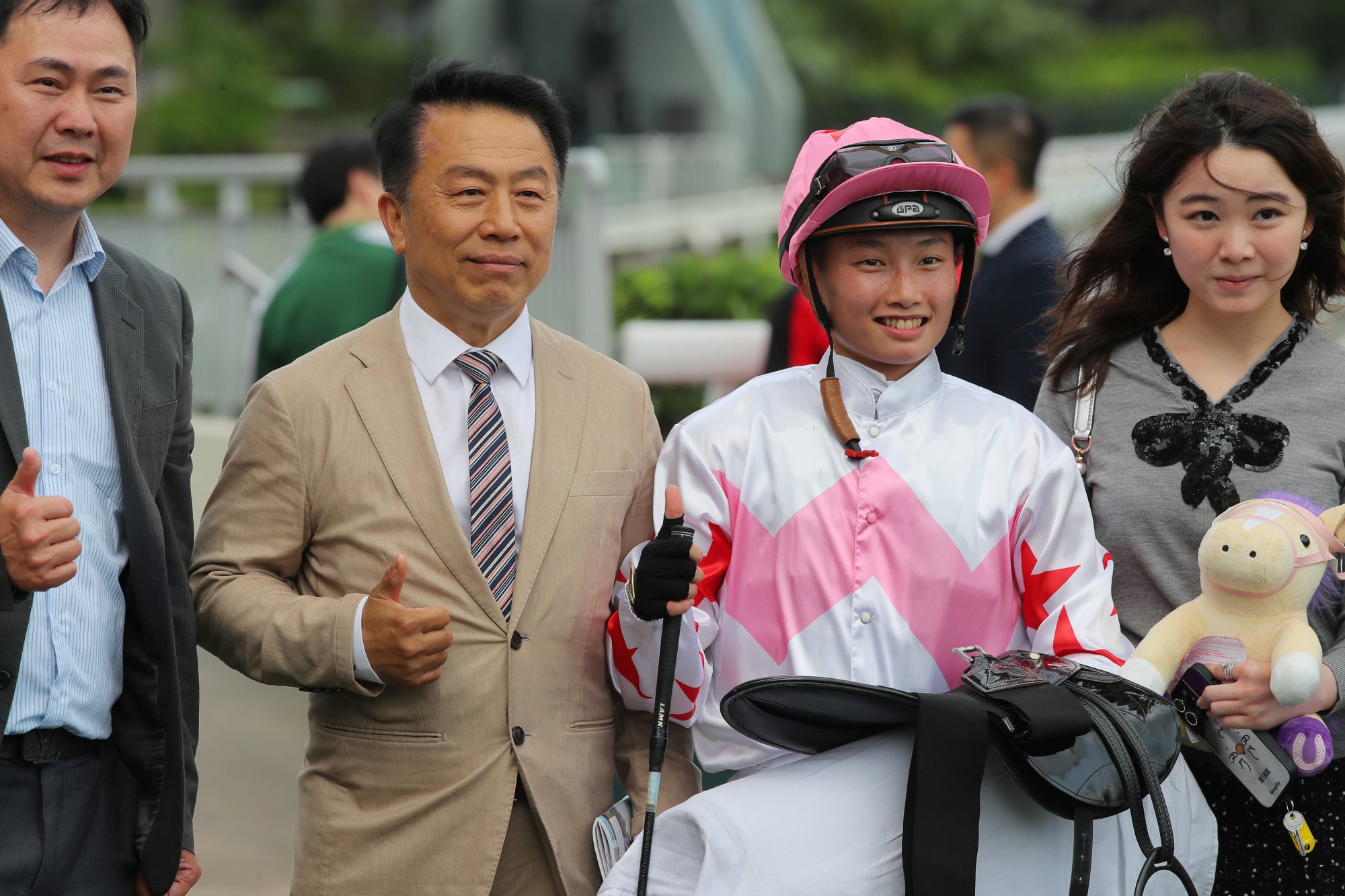 Trainer Ricky Yiu (second from left), apprentice Nichola Yuen and connections of Flashing Fighter are all smiles after the galloper’s debut win.