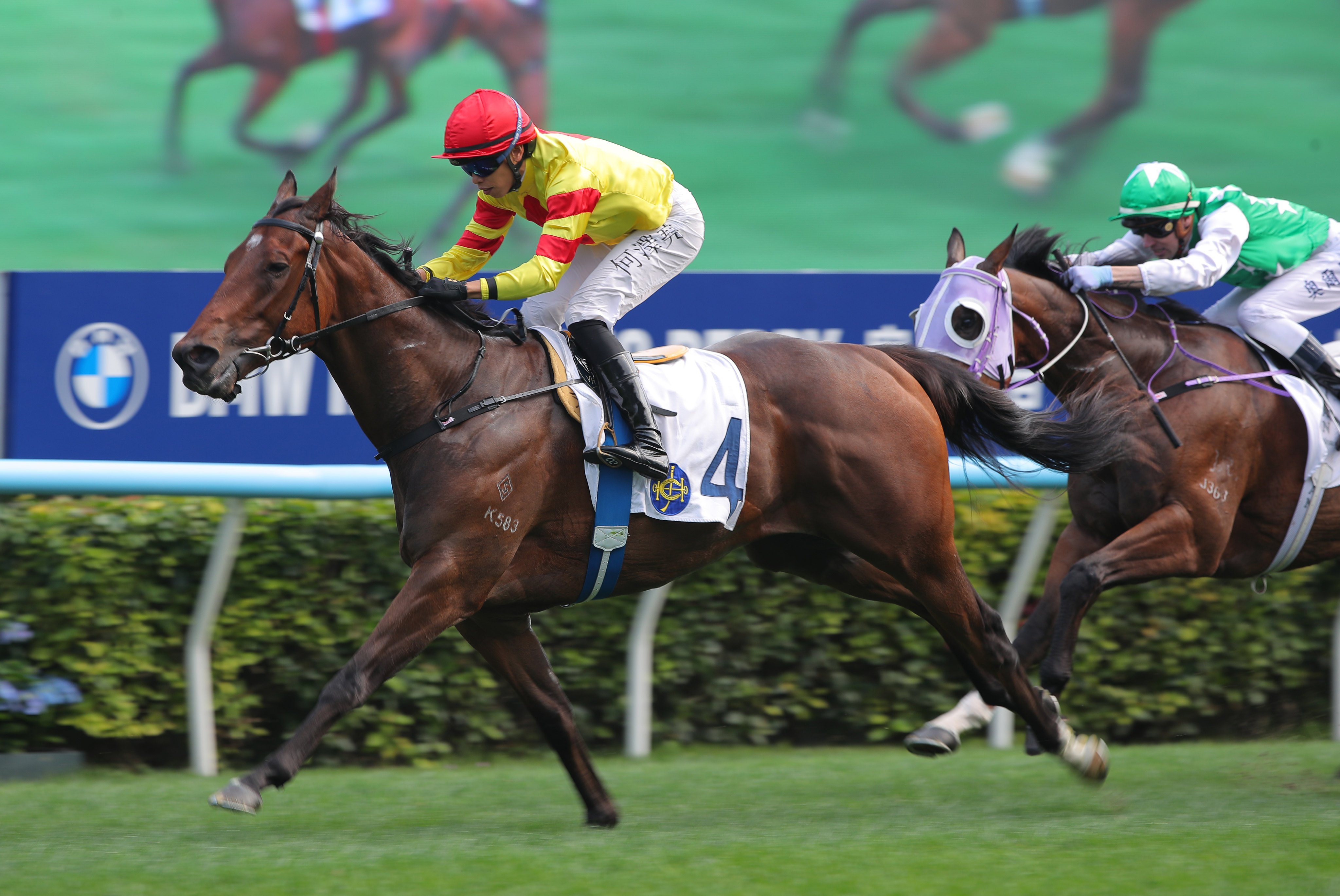 Vincent Ho guides Hot Delight to a third win from as many starts. Photos: Kenneth Chan