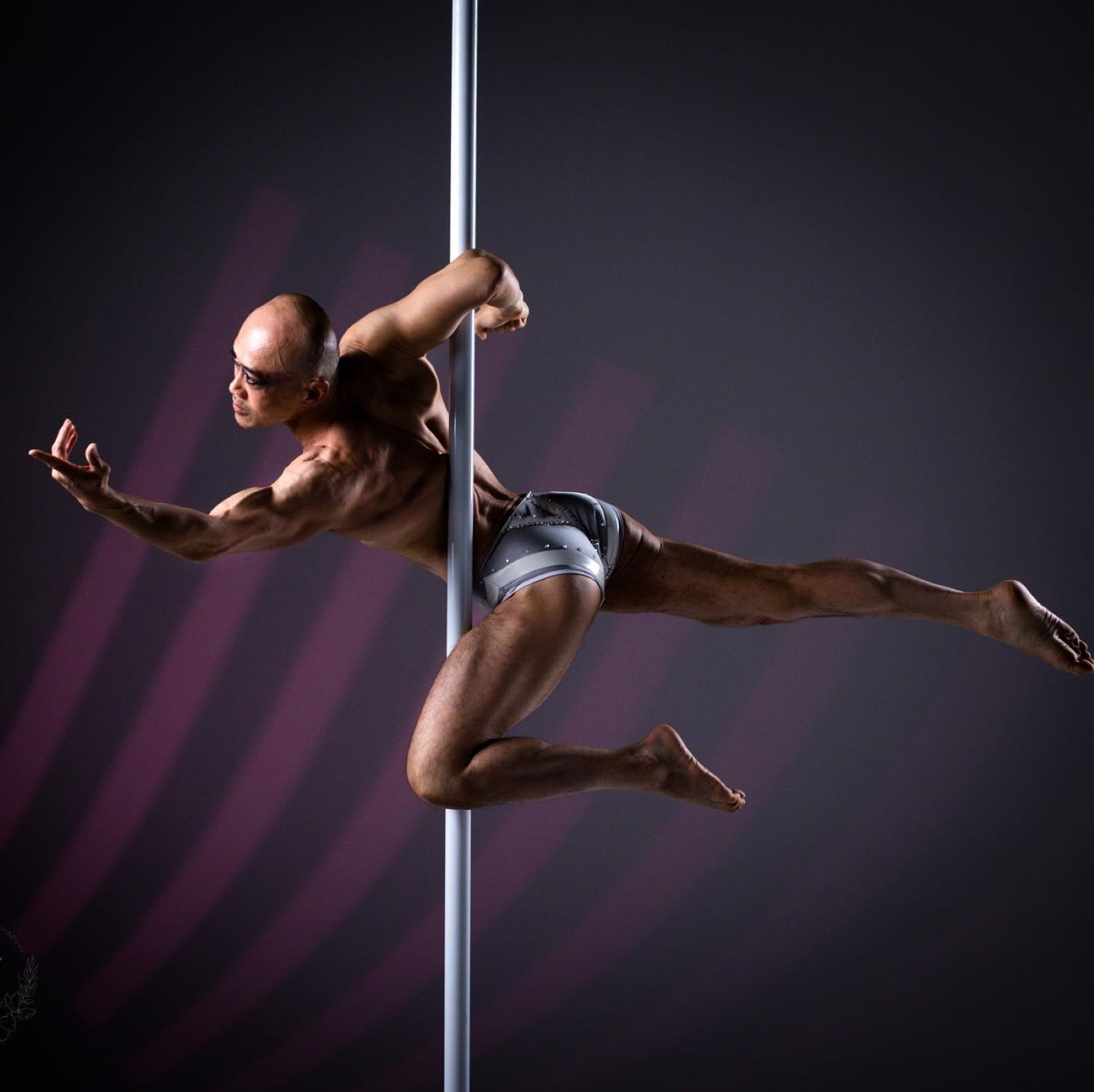 Ray Kayan performs graceful moves on a fitness pole, which require great strength and flexibility. Pole performance has been growing as a form of fitness since the 58-year-old started, even among men. Photo: Facebook/Ray Leung