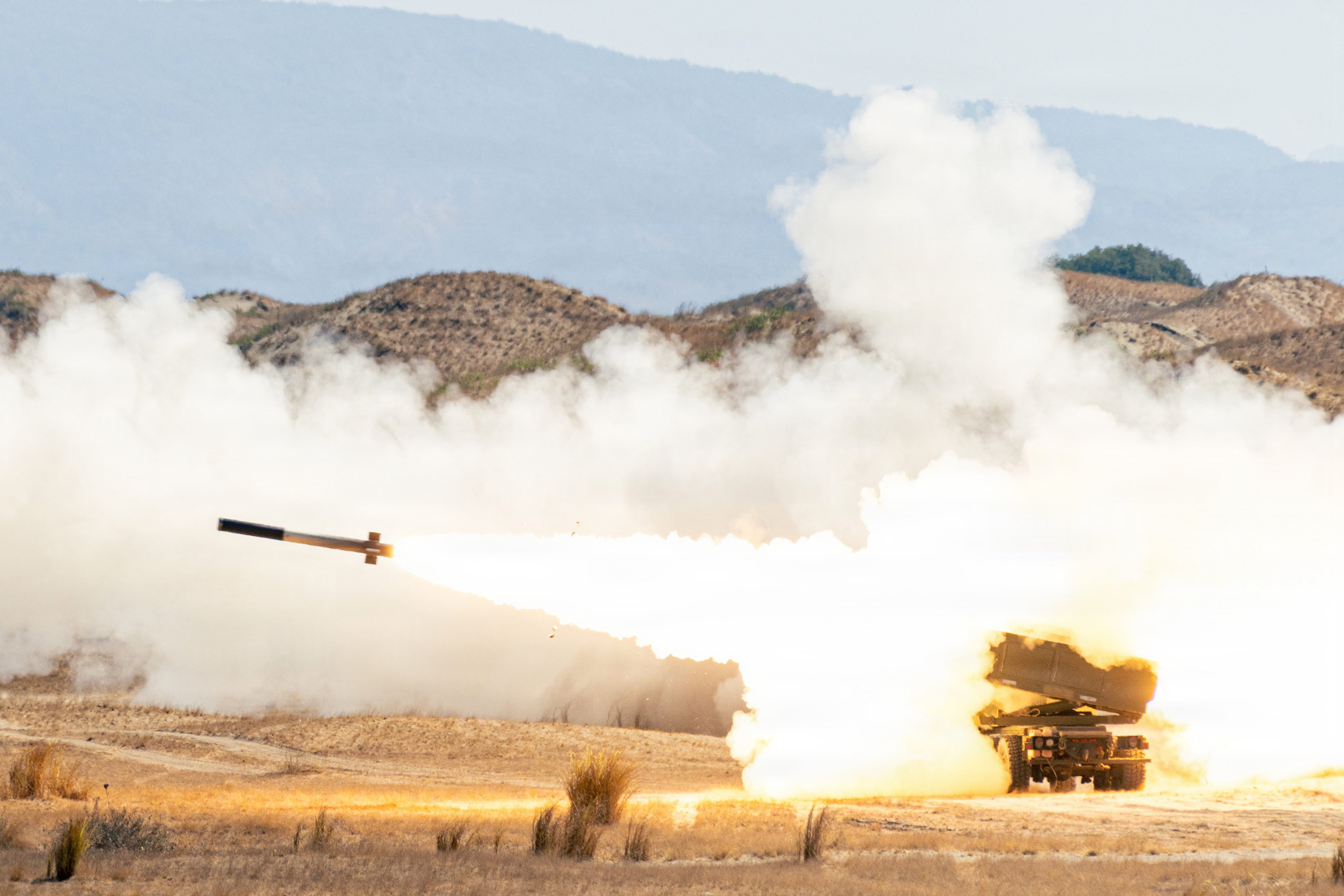 US soldiers fire a HIMARS projectile during a counter-landing live-fire exercise on Monday as part of Balikatan 2026 at La Paz Sand Dunes, Laoag City, the Philippines. Photo: US Army