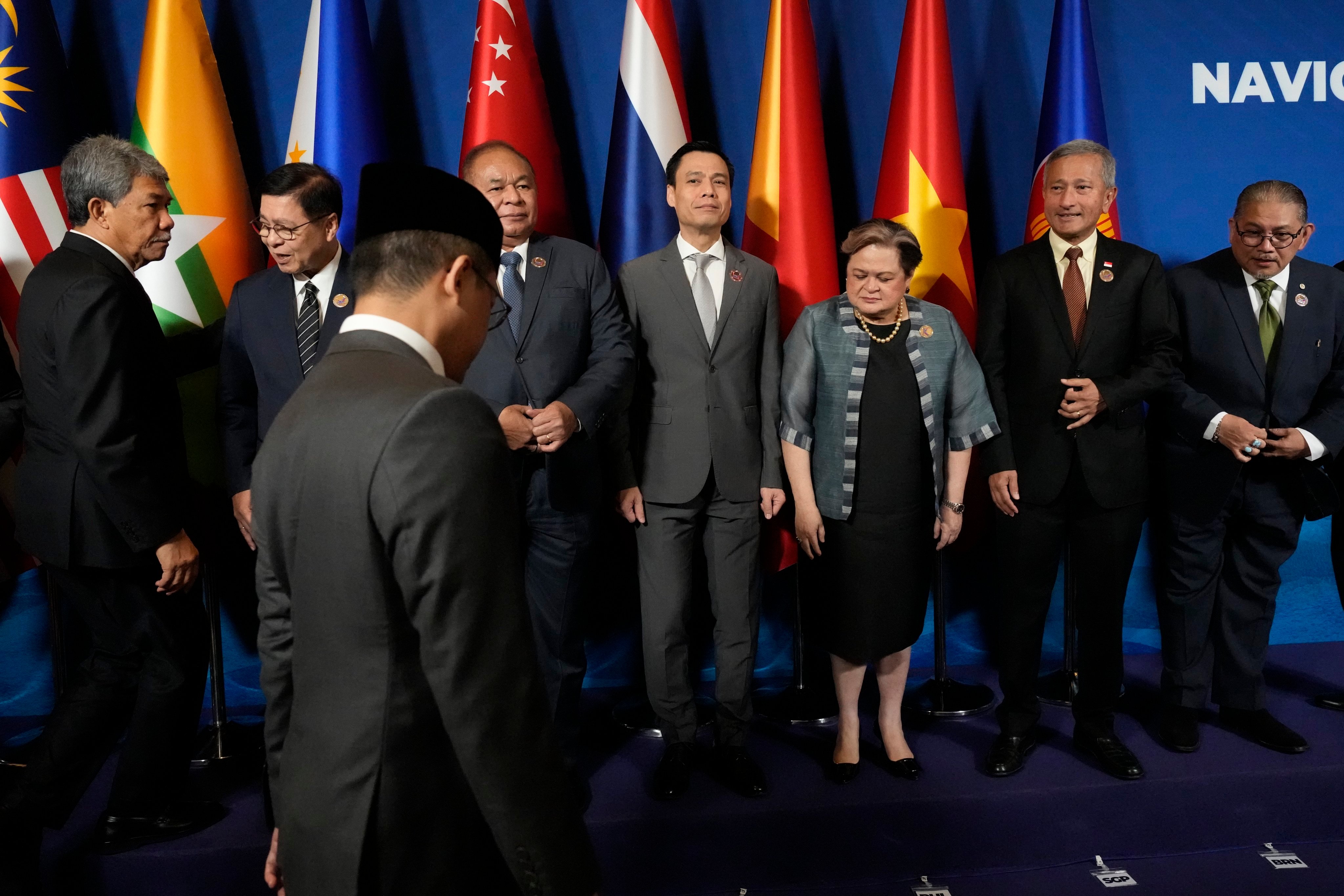 Myanmar’s Permanent Secretary of the Ministry of Foreign Affairs U Hau Khan Sum (left) joins Asean foreign ministers for a group photo at the Foreign Ministers’ Meeting in Cebu on Thursday. Photo: EPA