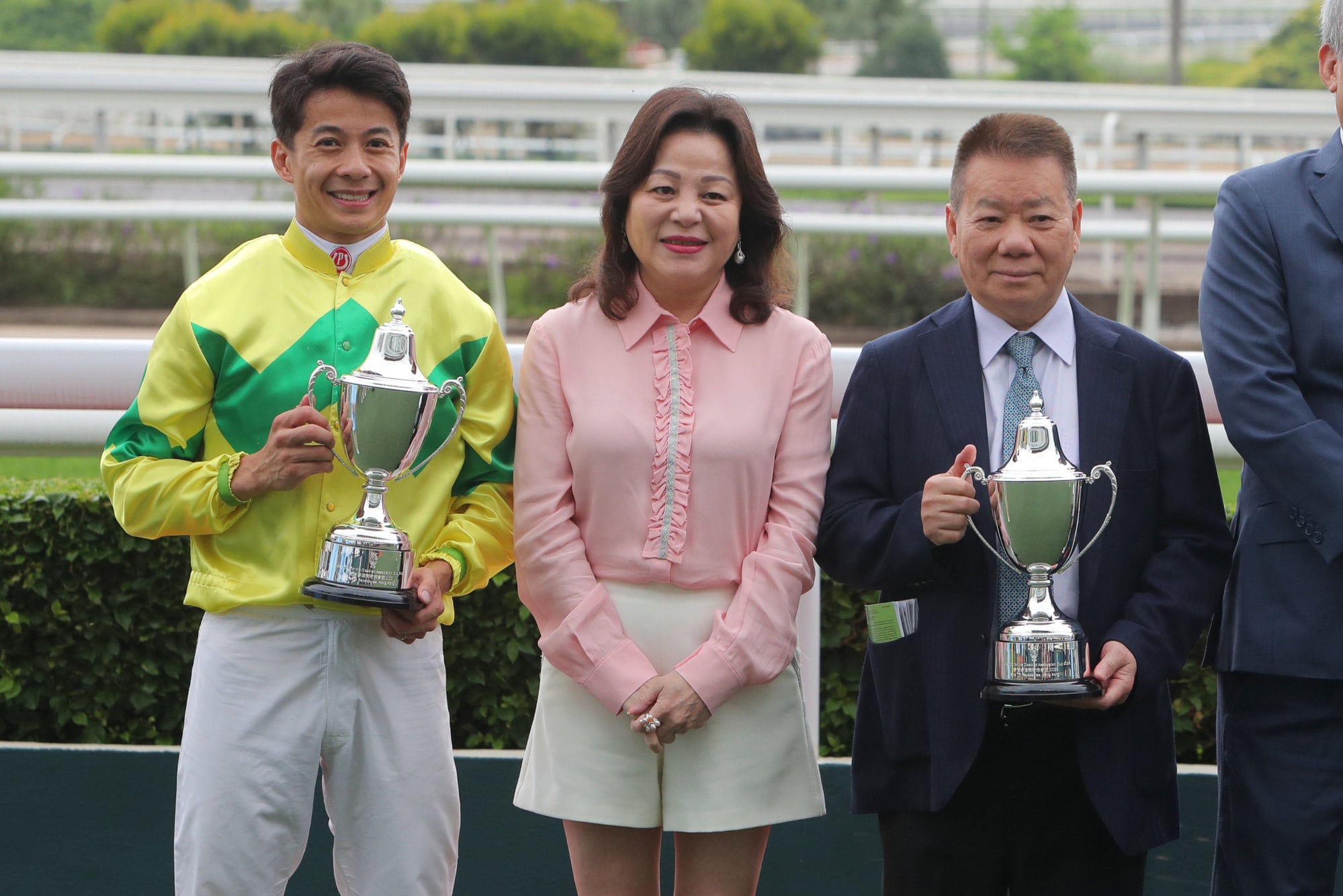 Jockey Derek Leung and trainer Manfred Man celebrate Real Gentleman’s stunning upset victory.