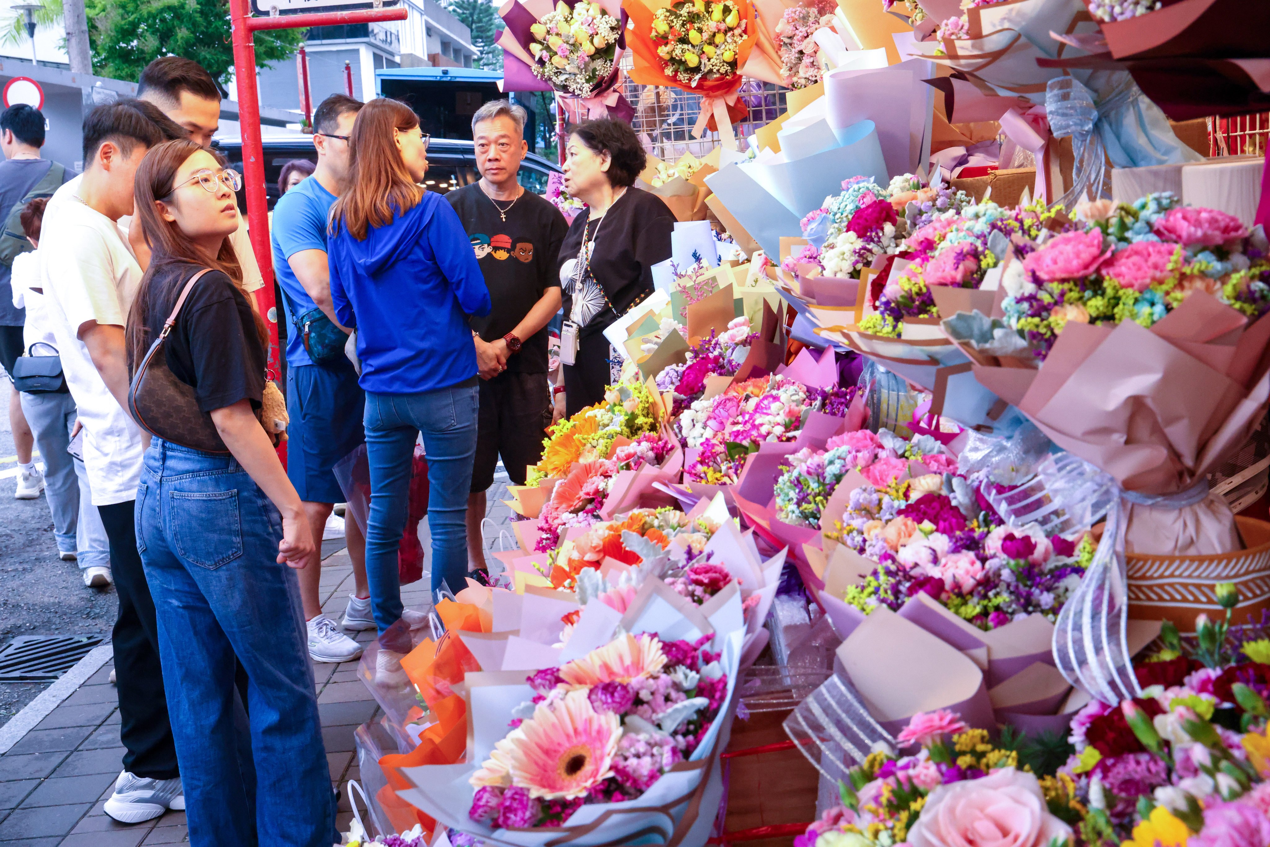 Florists on Flower Market Road offer up bouquets for sale on the day before Mother’s Day. Photo: Dickson Lee