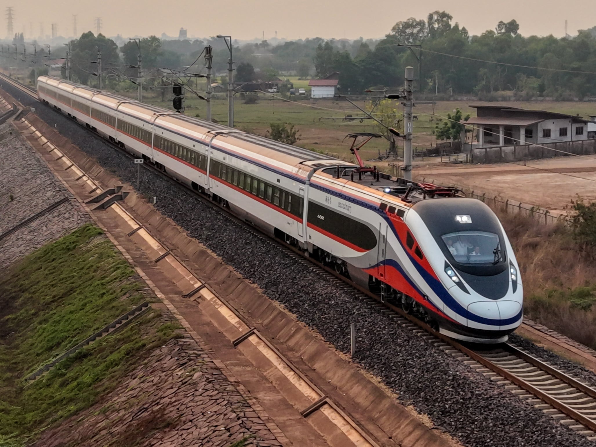 An aerial drone photo taken on April 13 shows a train of the China-Laos Railway, departing from Kunming in southwest China’s Yunnan province, arriving in Vientiane, Laos. Photo: Xinhua