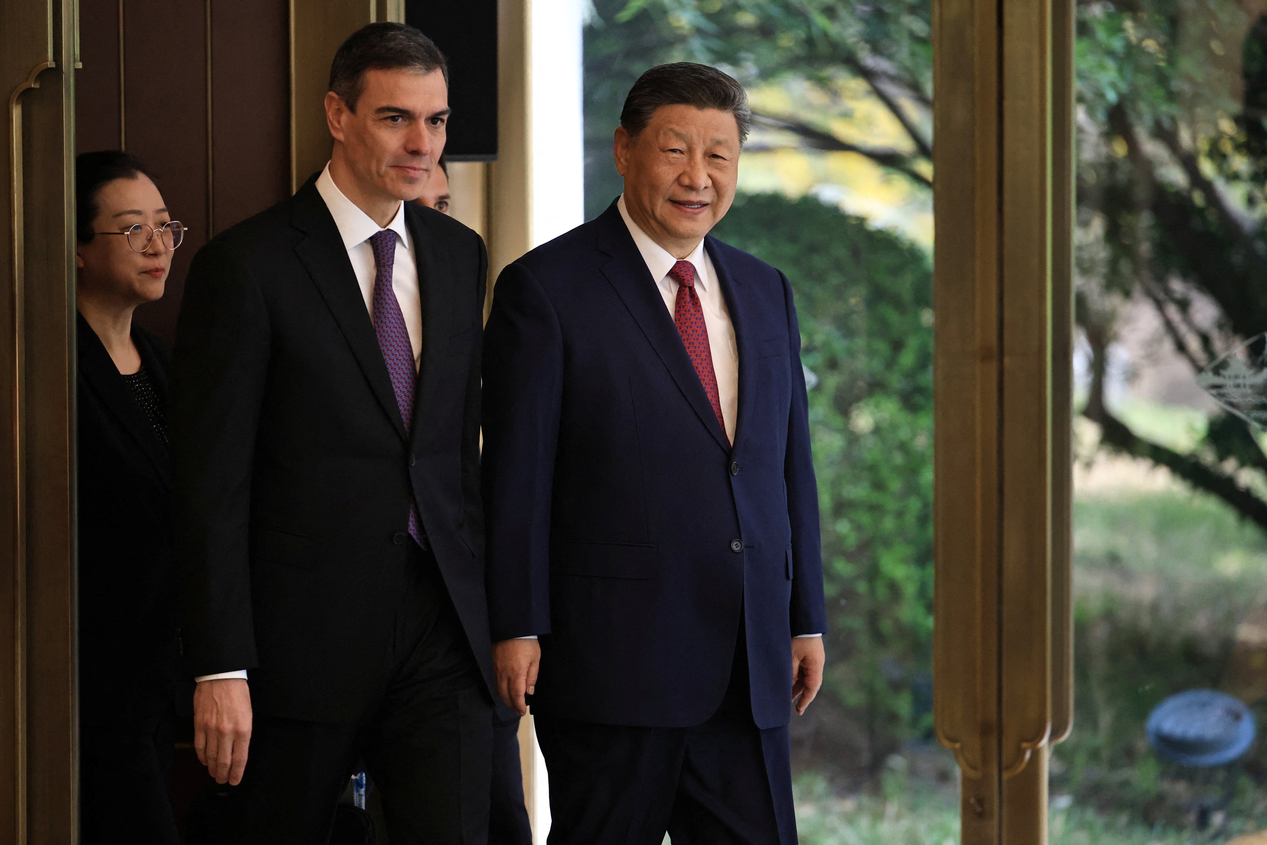 Chinese President Xi Jinping (right) and Spanish Prime Minister Pedro Sanchez (left) arrive at the Diaoyutai Guest House in Beijing on April 11. Photo: Reuters