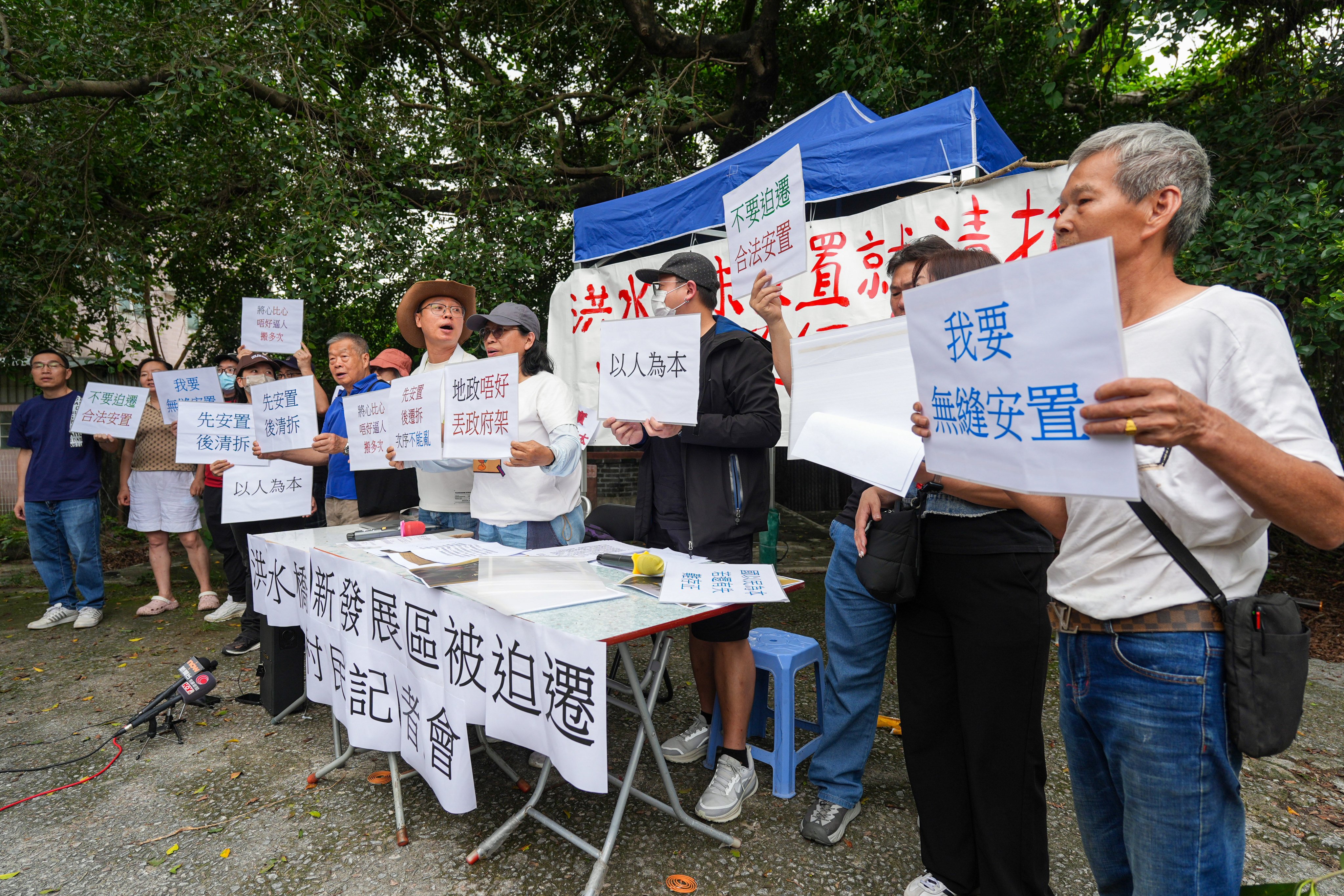Yick Yuen Tsuen villagers speak to the media over forced relocations. The village falls within the government’s planned Hung Shui Kiu/Ha Tsuen New Development Area. Photo: Eugene Lee
