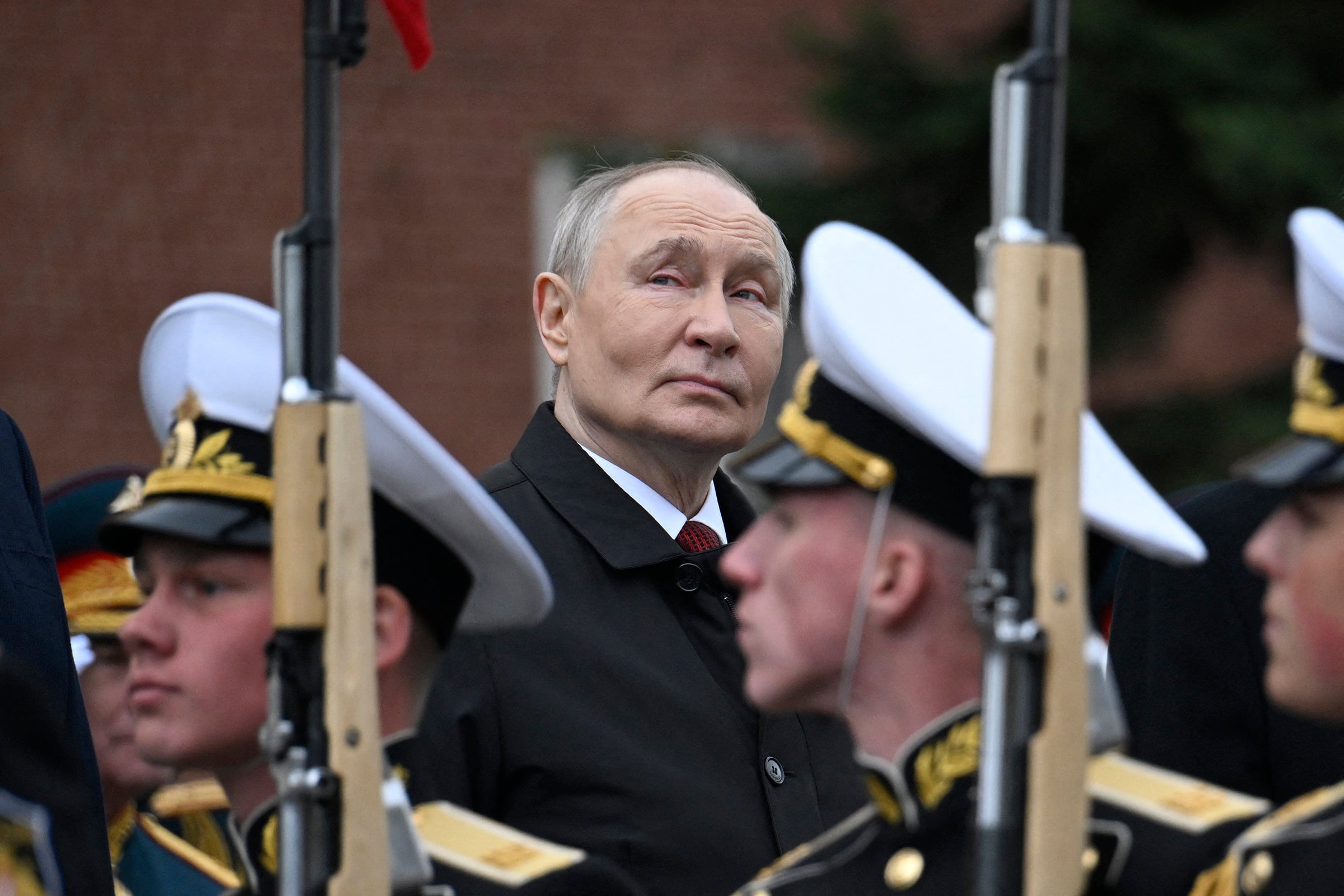 Russian President Vladimir Putin attends a ceremony to lay flowers at the Tomb of the Unknown Soldier in central Moscow on Saturday. Photo: AFP