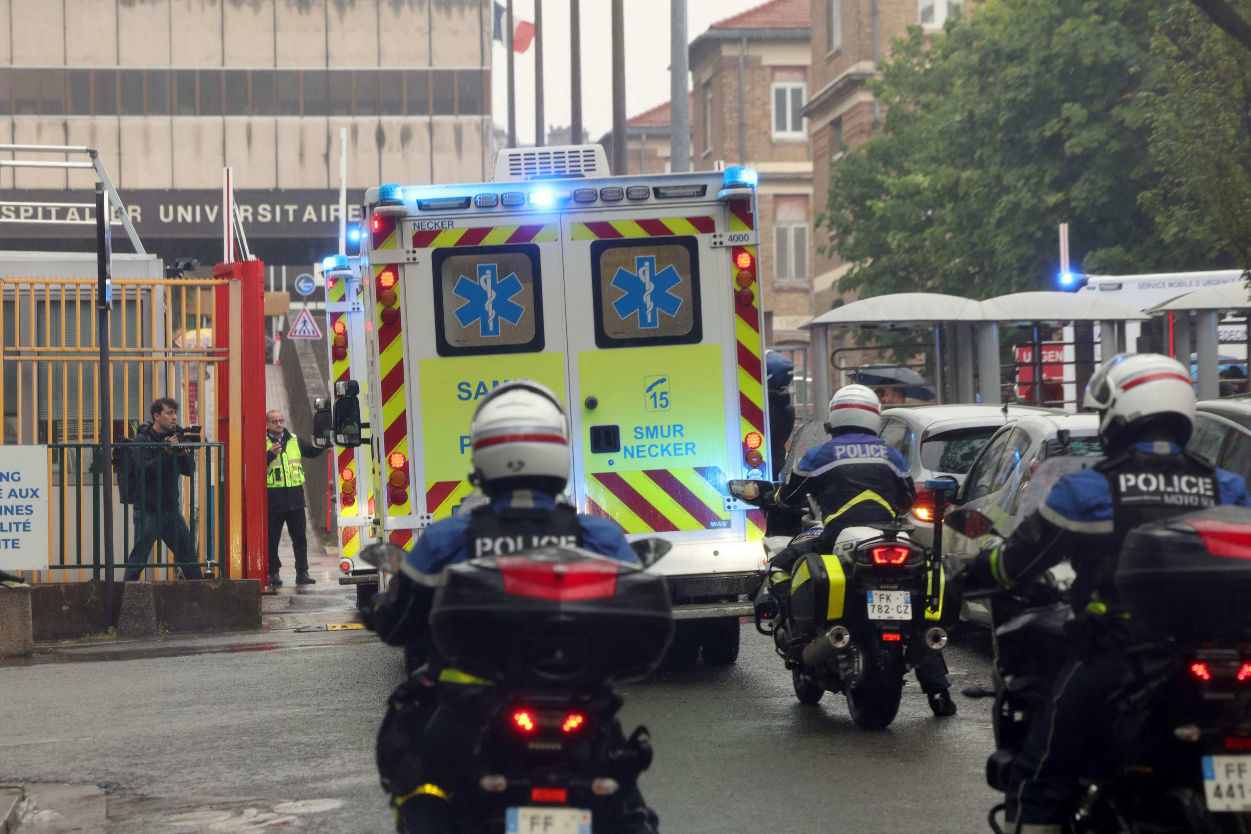 Ambulances transporting French national passengers of the MV Hondius arrive at the Bichat hospital in Paris on Sunday. Photo: AFP