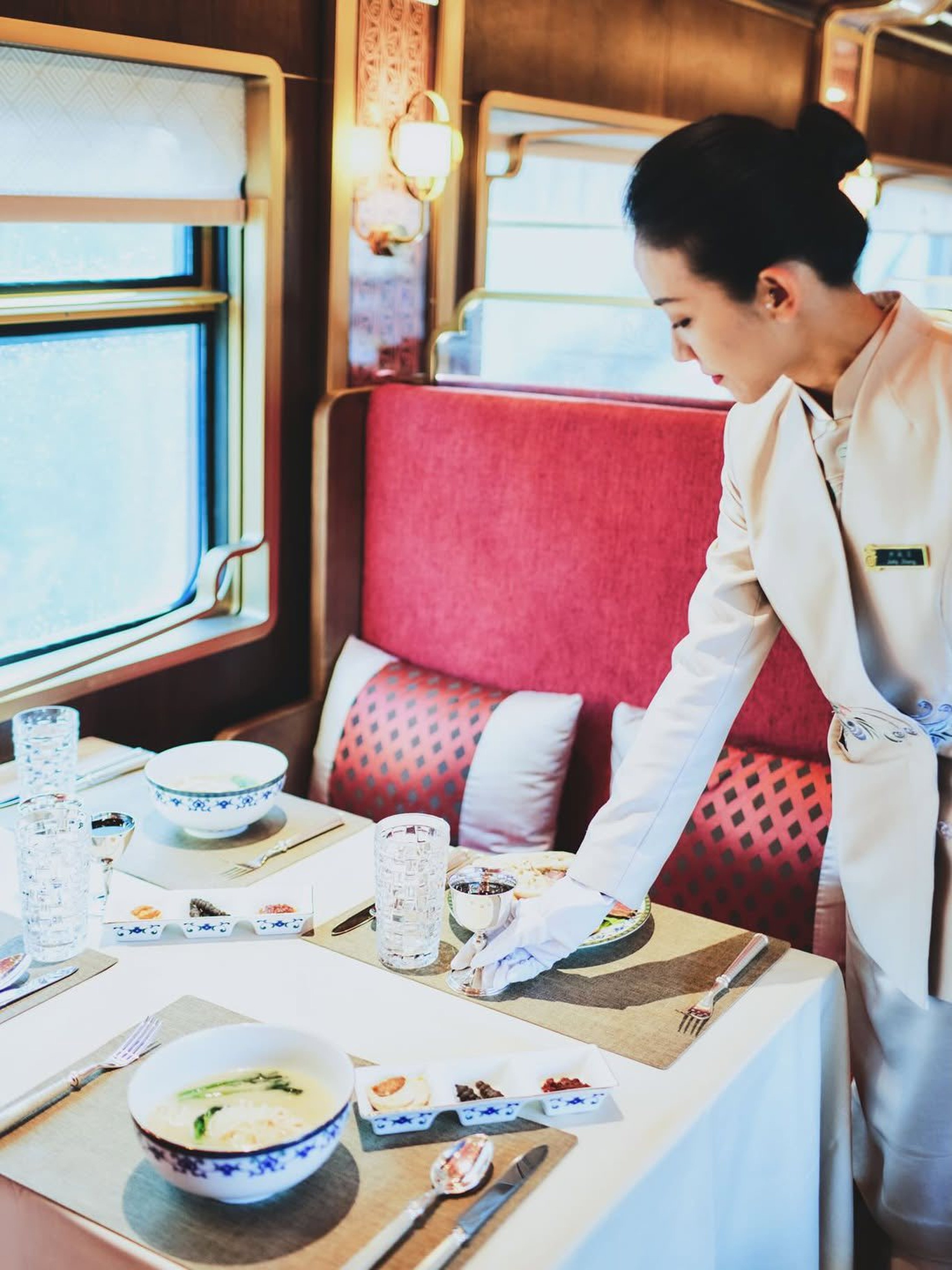 A meal is served aboard the Silk Road Express, a luxury tourist train in China that recently started operating a new route straddling Sichuan and Yunnan provinces. Photo: Courtesy of Train of Glamour