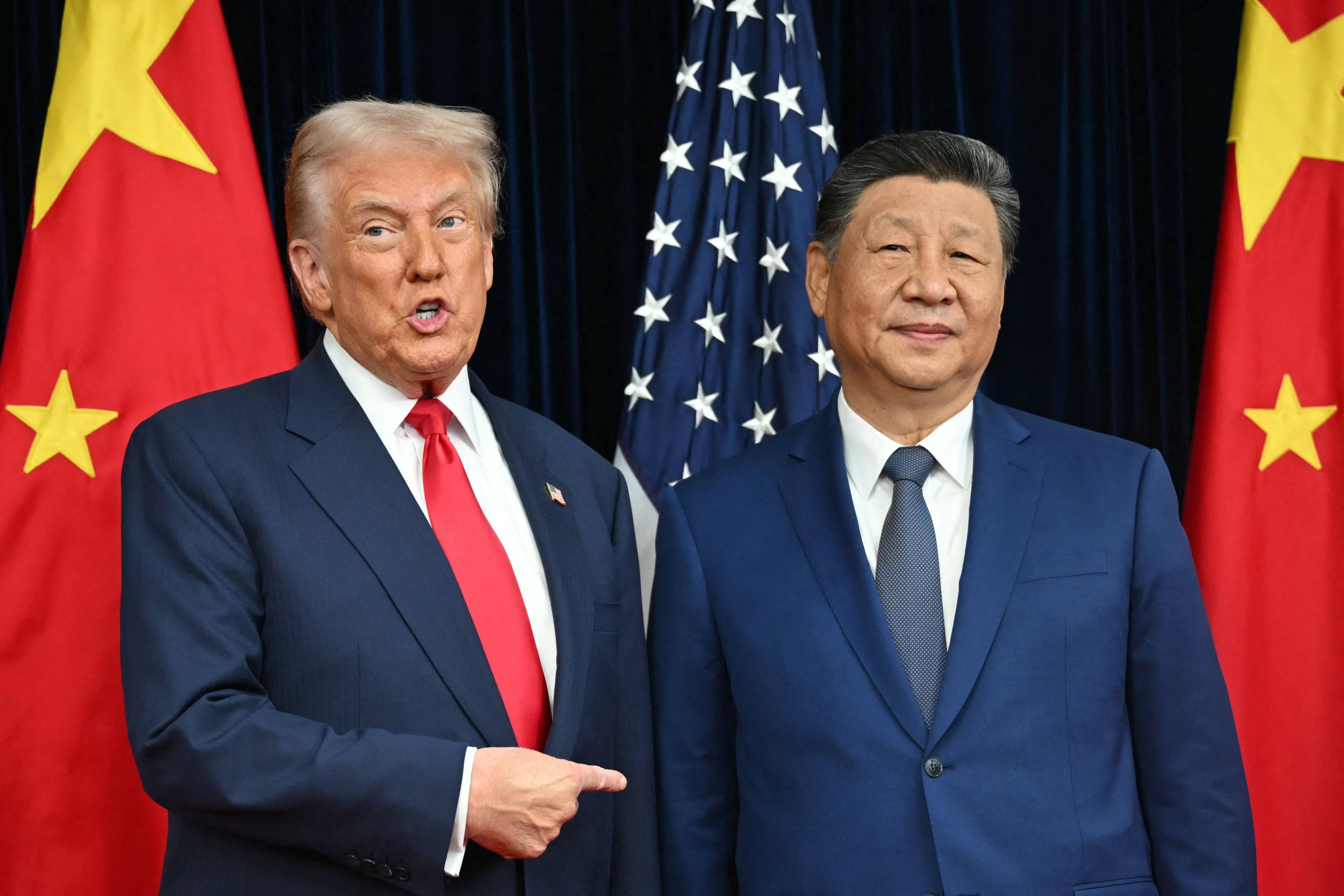 US President Donald Trump and China’s President Xi Jinping arrive for talks at the Gimhae Air Base in Busan on October 30, 2025. Photo: AFP