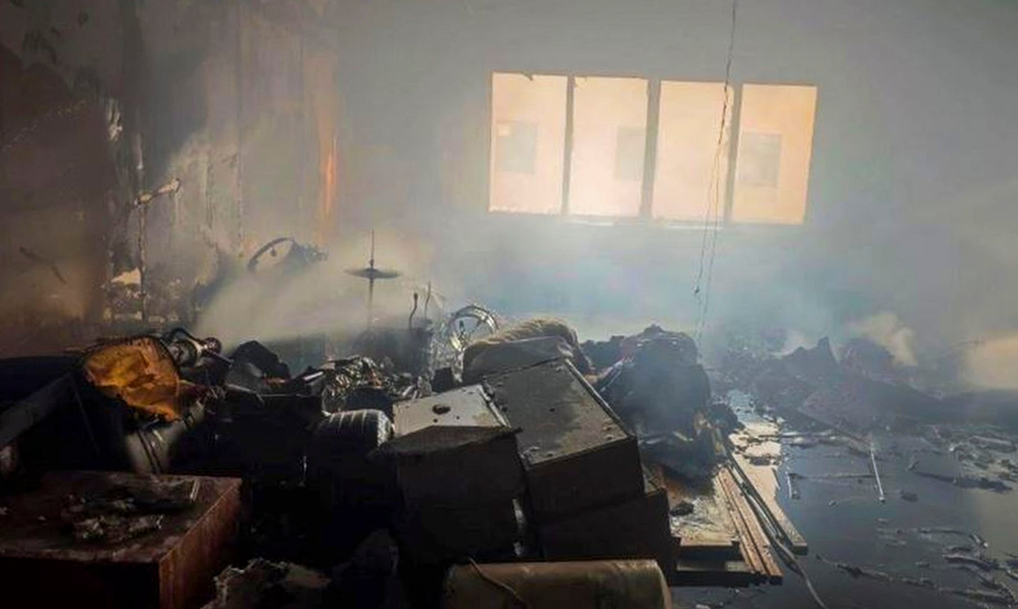 A window in the background sheds light on the gutted office space. Photo: Weibo