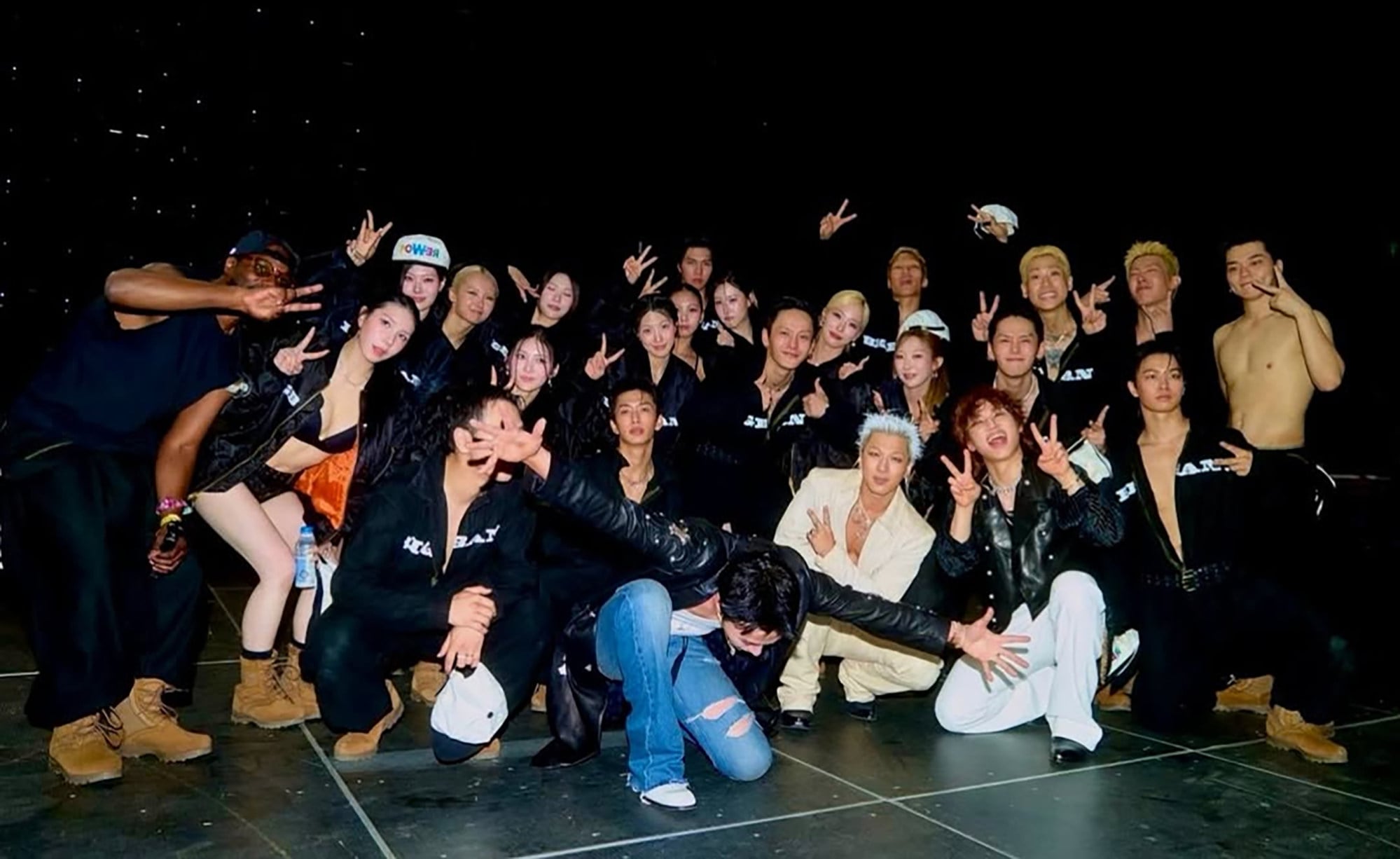 G-Dragon, in a white suit, is recognised for his generous approach to staff compensation, which includes salaries that are double the industry average and extravagant gifts. Photo: IG@xxxibgdrgn G-Dragon, in a white suit, is recognised for his generous approach to staff compensation, which includes salaries that are double the industry average and extravagant gifts. Photo: IG@xxxibgdrgn