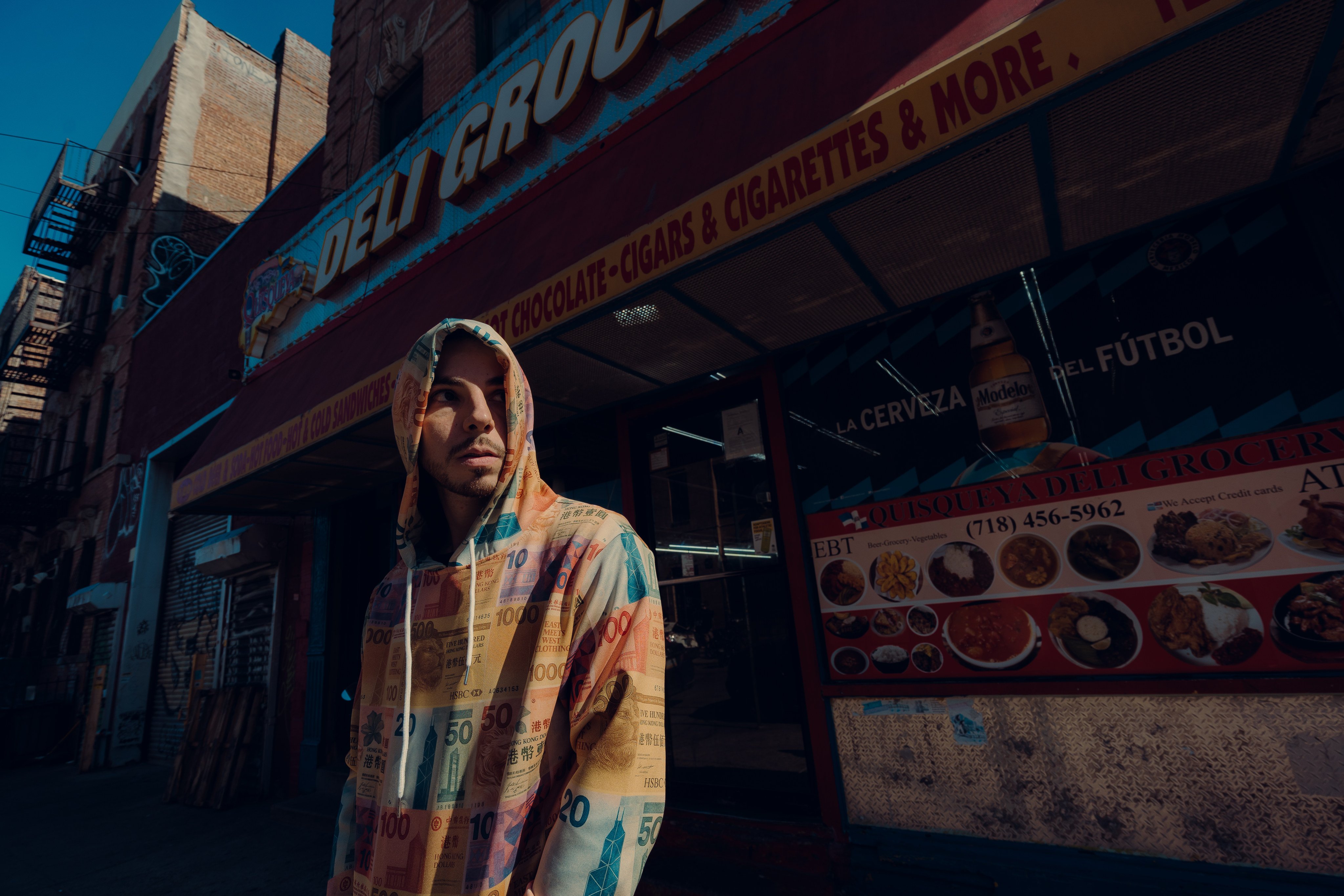 Lucas Scibetta wears a hoodie plastered with images of Hong Kong bank notes, a design from his upcoming clothing collection. The rapper hit viral fame in 2012 with his song “Hong Kong Kids”.  Photo: courtesy of Lucas Scibetta