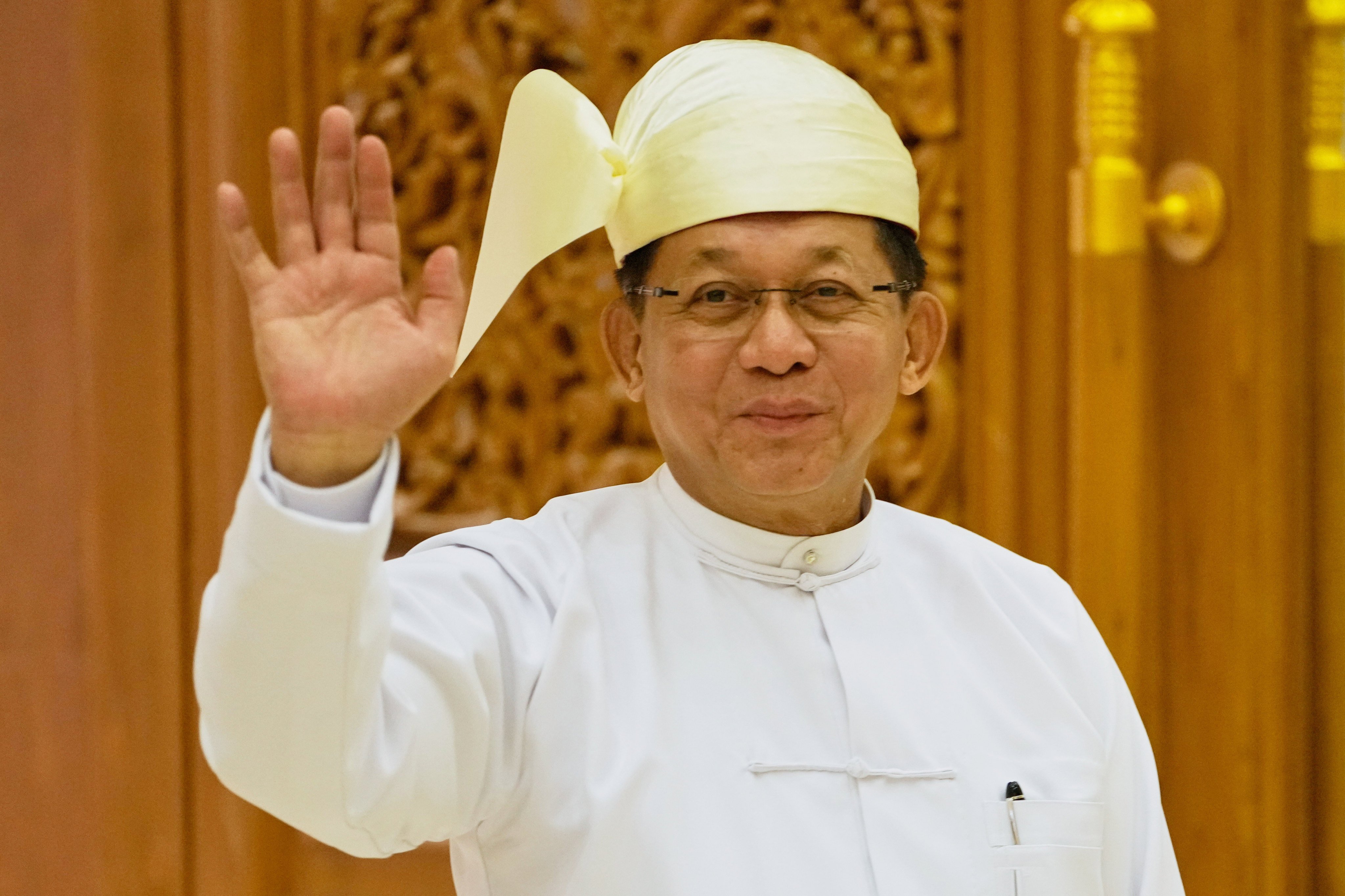 Myanmar’s newly elected President Min Aung Hlaing waves as he leaves after a swearing-in ceremony in Naypyidaw on April 10. Photo: AP