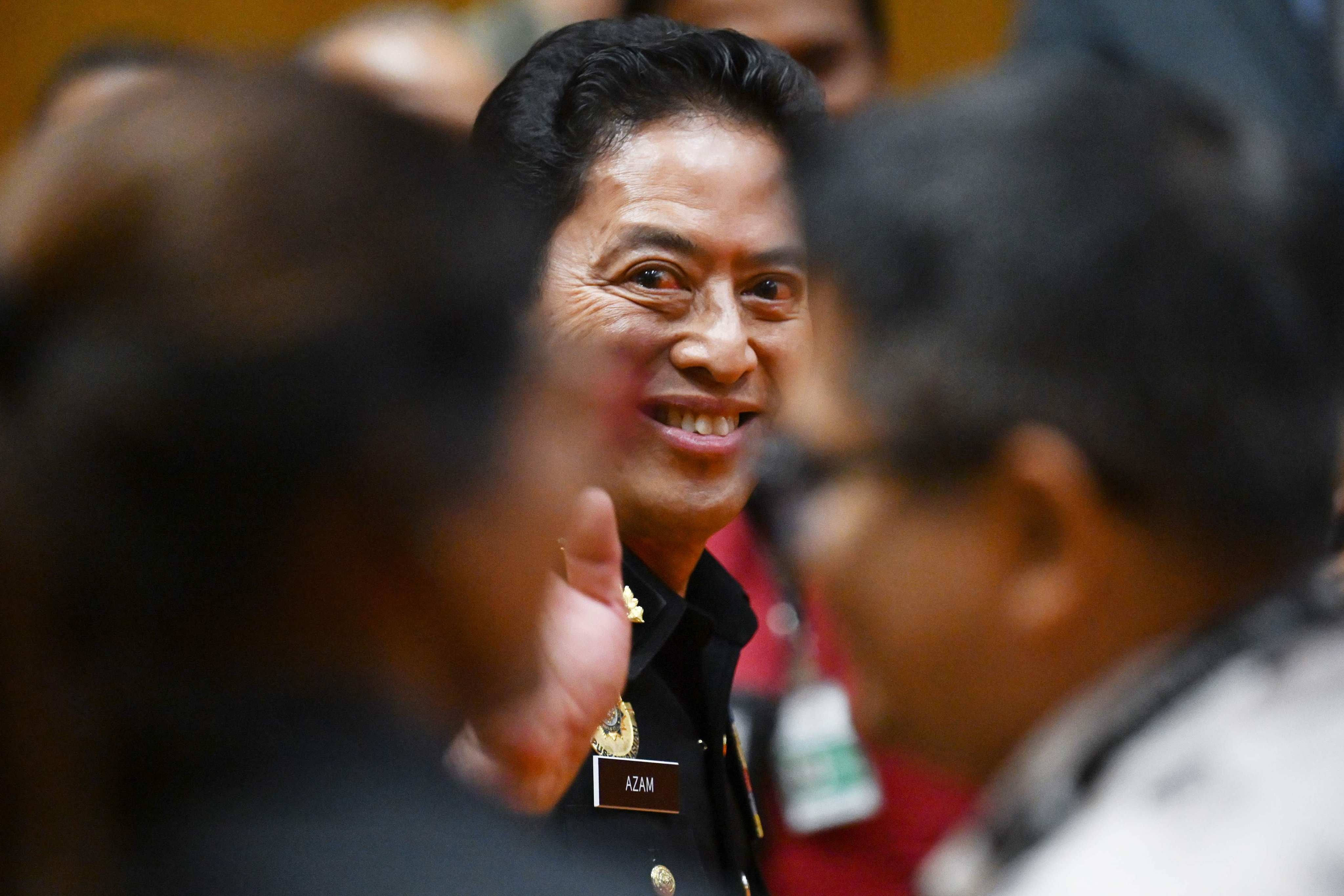 Azam Baki waves after a press conference on repatriated artworks linked to 1MDB asset recovery at the MACC headquarters in Putrajaya on May 6. Photo: AFP