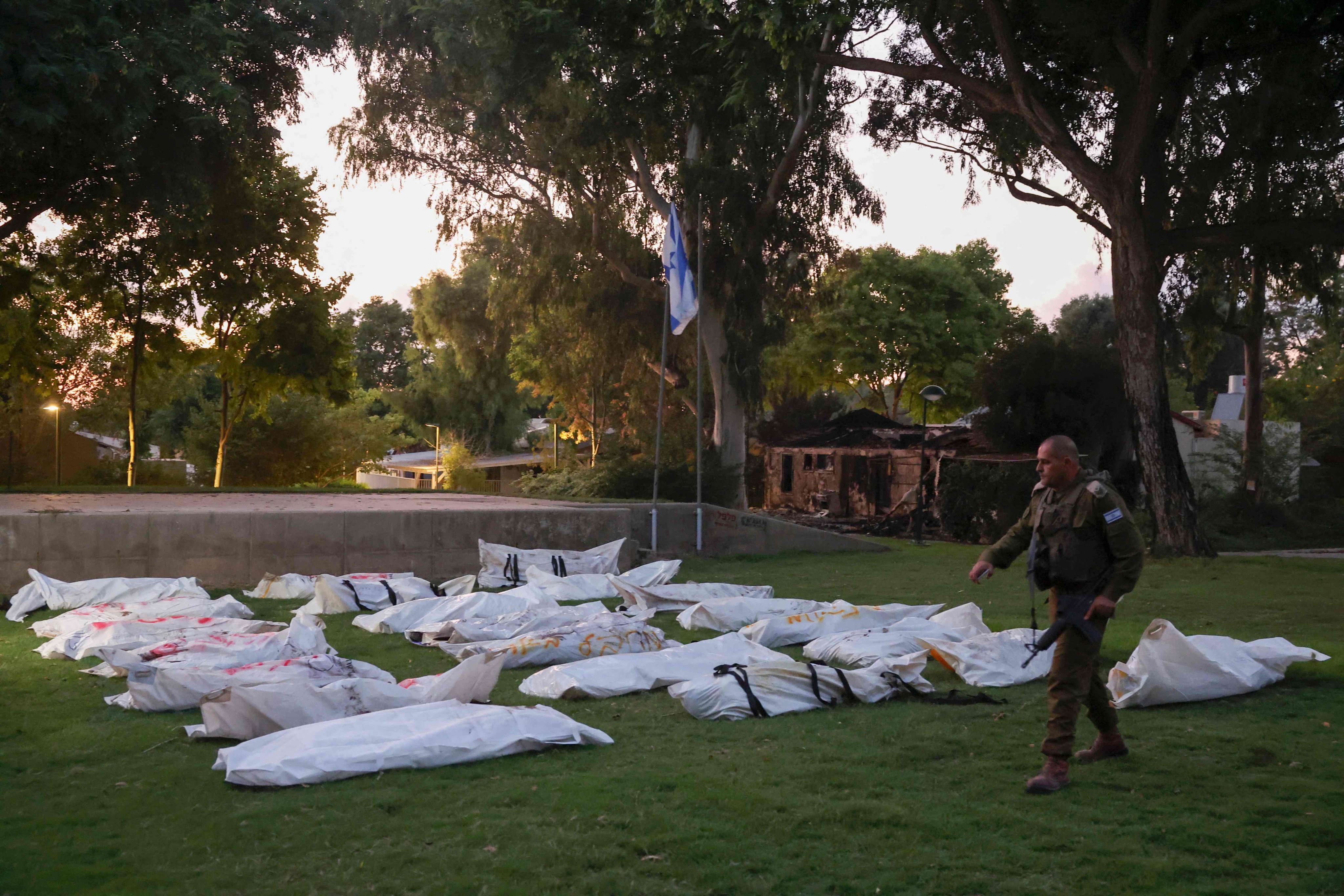 Covered bodies at Kibbutz Beeri on October 11, 2023. Photo: AFP