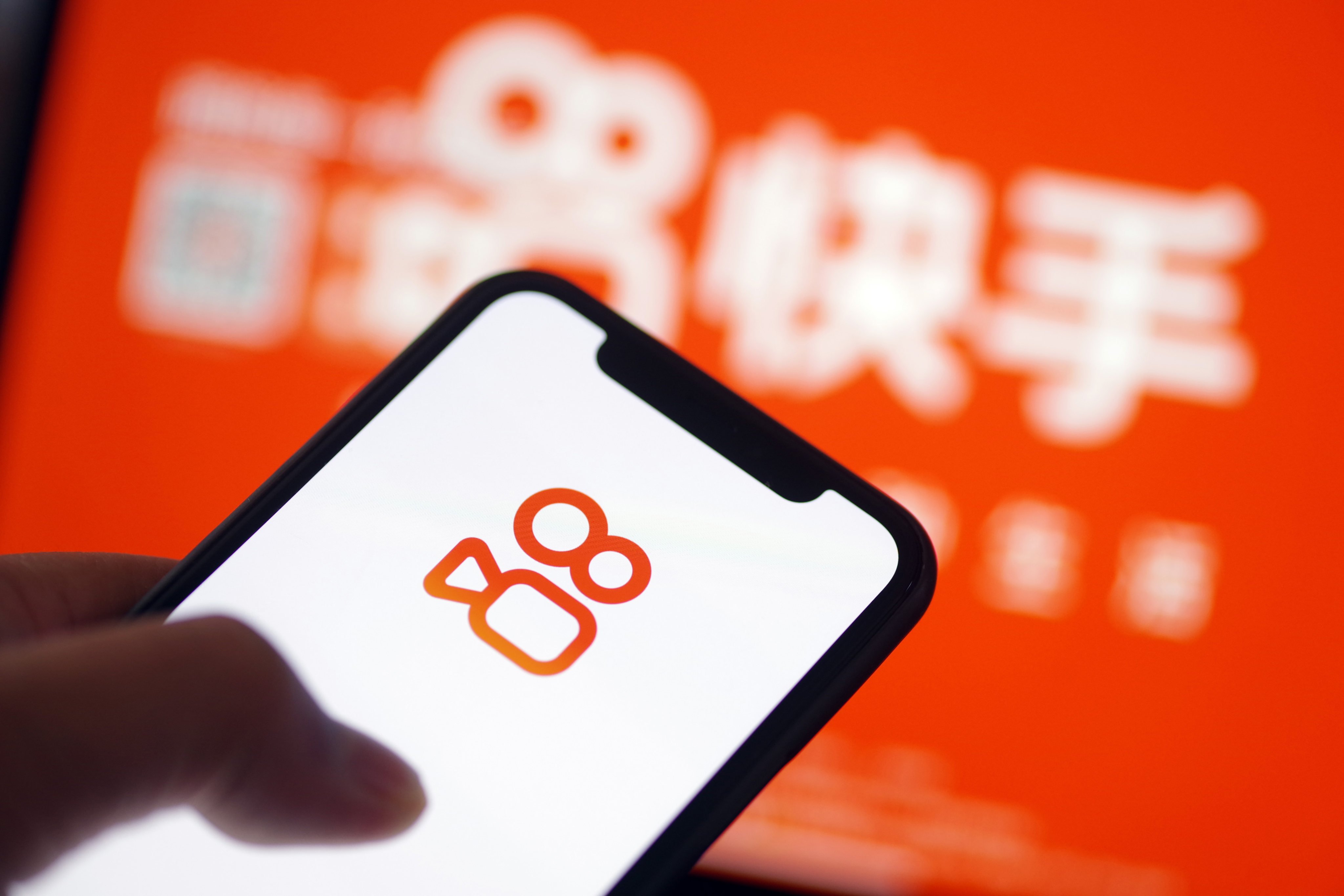 The logo of Chinese short-video platform Kuaishou is displayed on a smartphone screen in Jinan, Shandong province. Photo: Getty Images