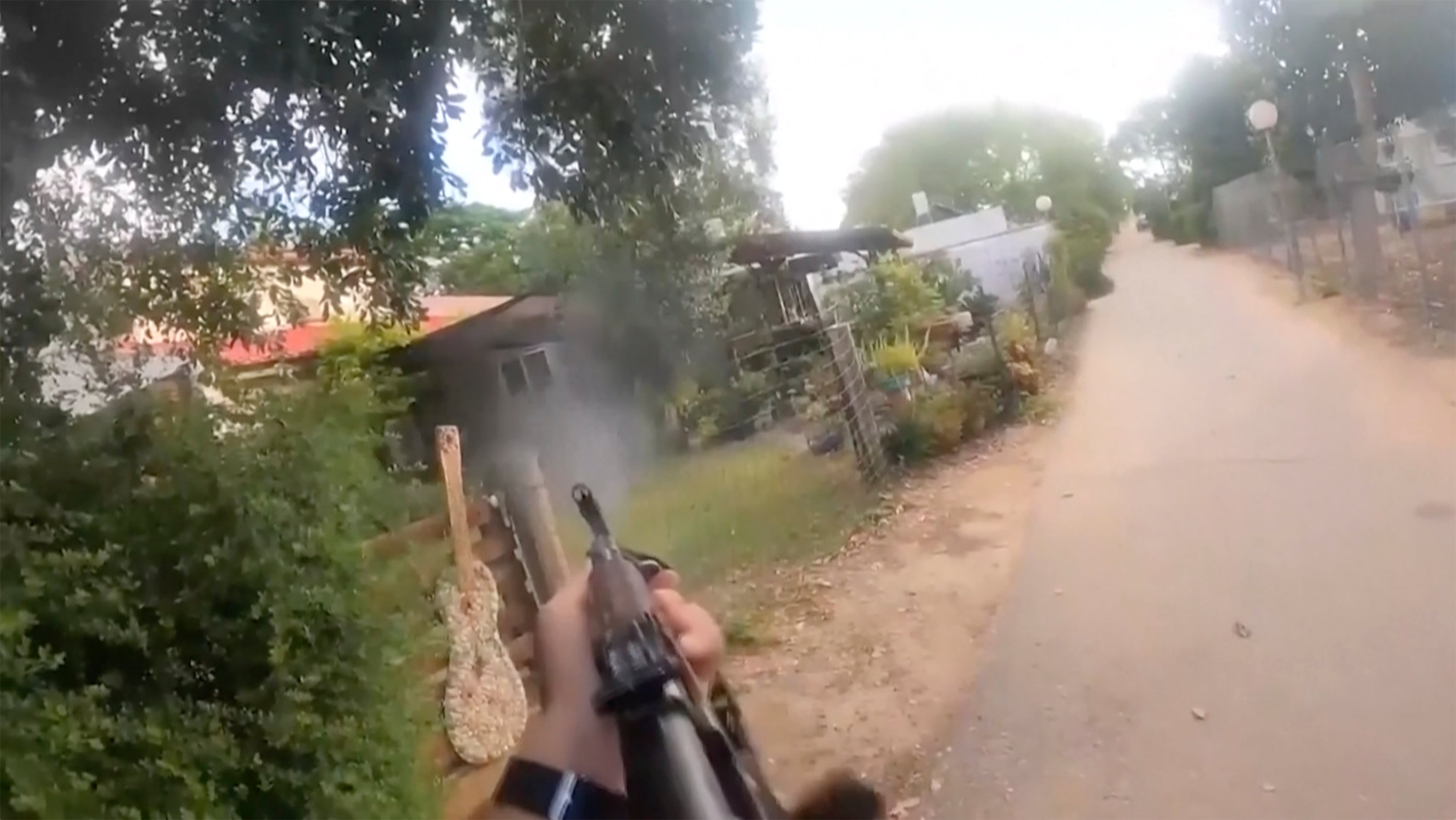 A bodycam image of a Hamas militant firing in an Israeli neighbourhood on October 7, 2023. Photo: Israel Defence Forces via AP