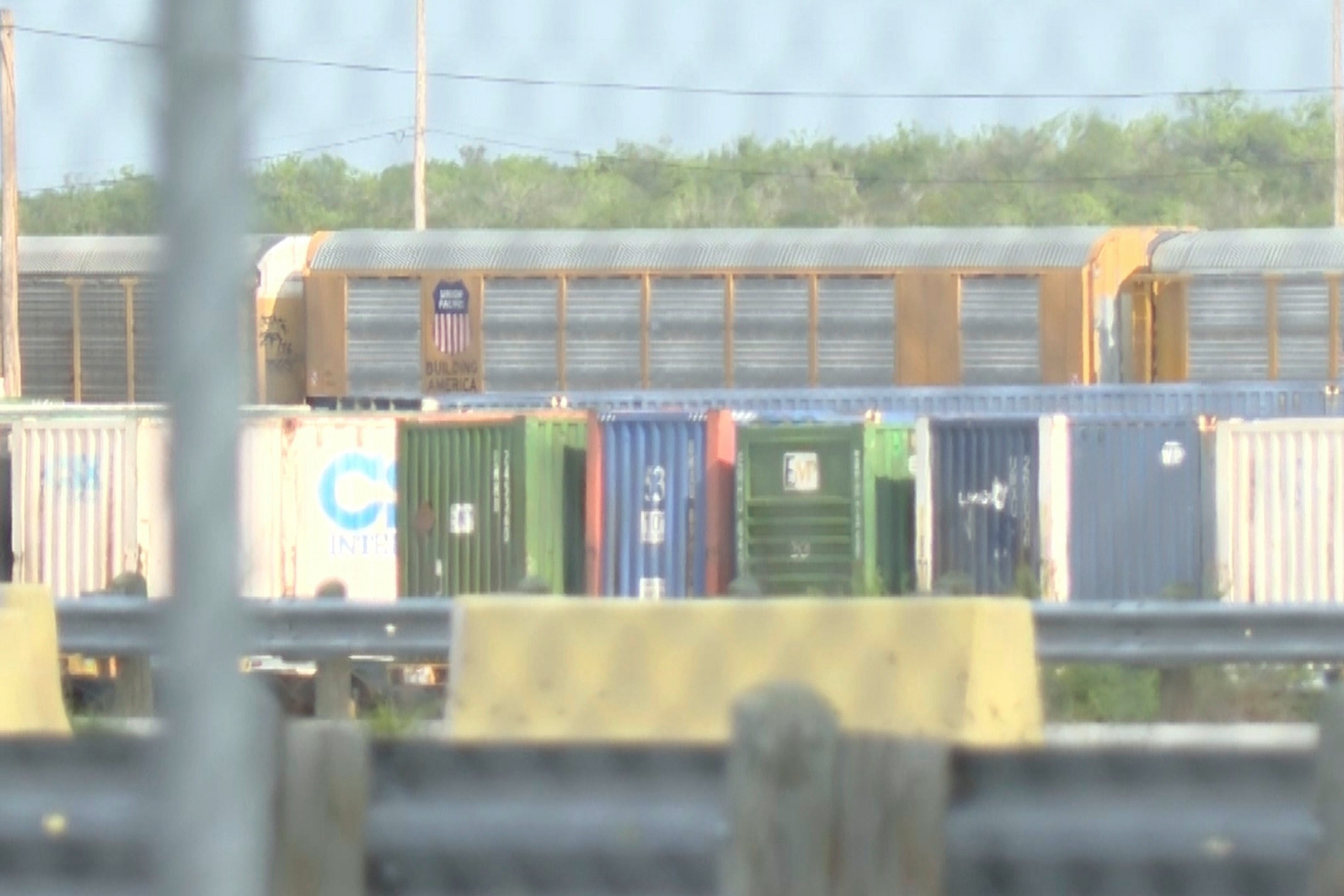 In an image taken from video footage provided by KGNS, Union Pacific train cars are stationed at a railway depot in Laredo, Texas on Sunday, Photo: KGNS via AP
