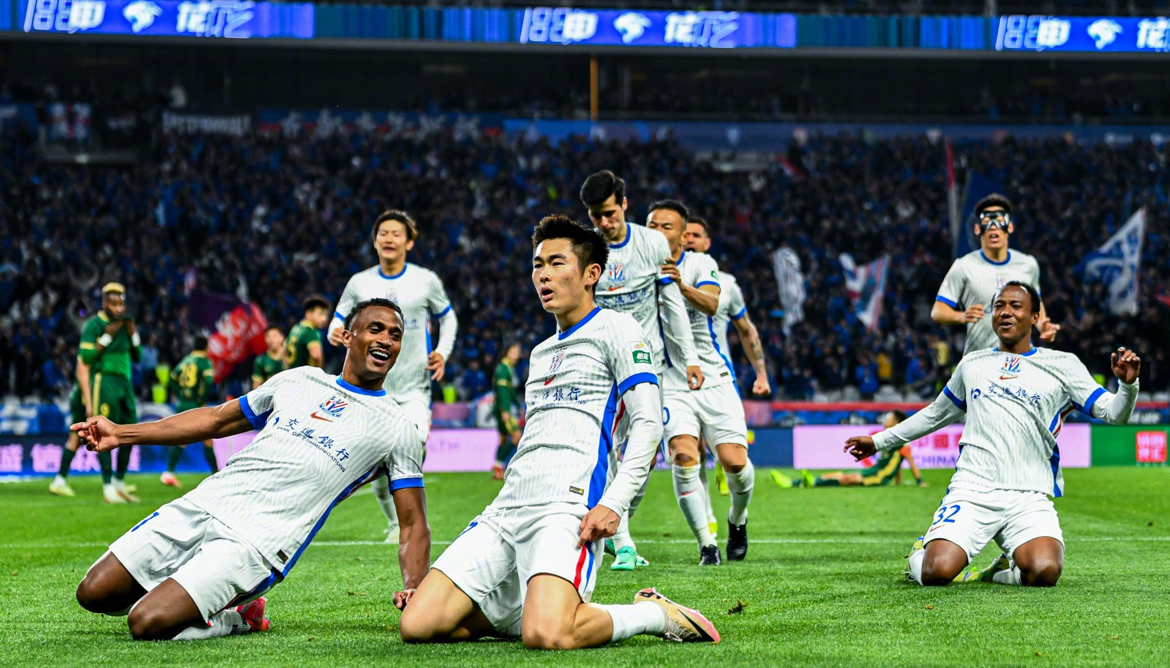 Shinichi Chan (middle) celebrates scoring for Shanghai Shenhua. Photo: Weibo/ Shanghai Shenhua